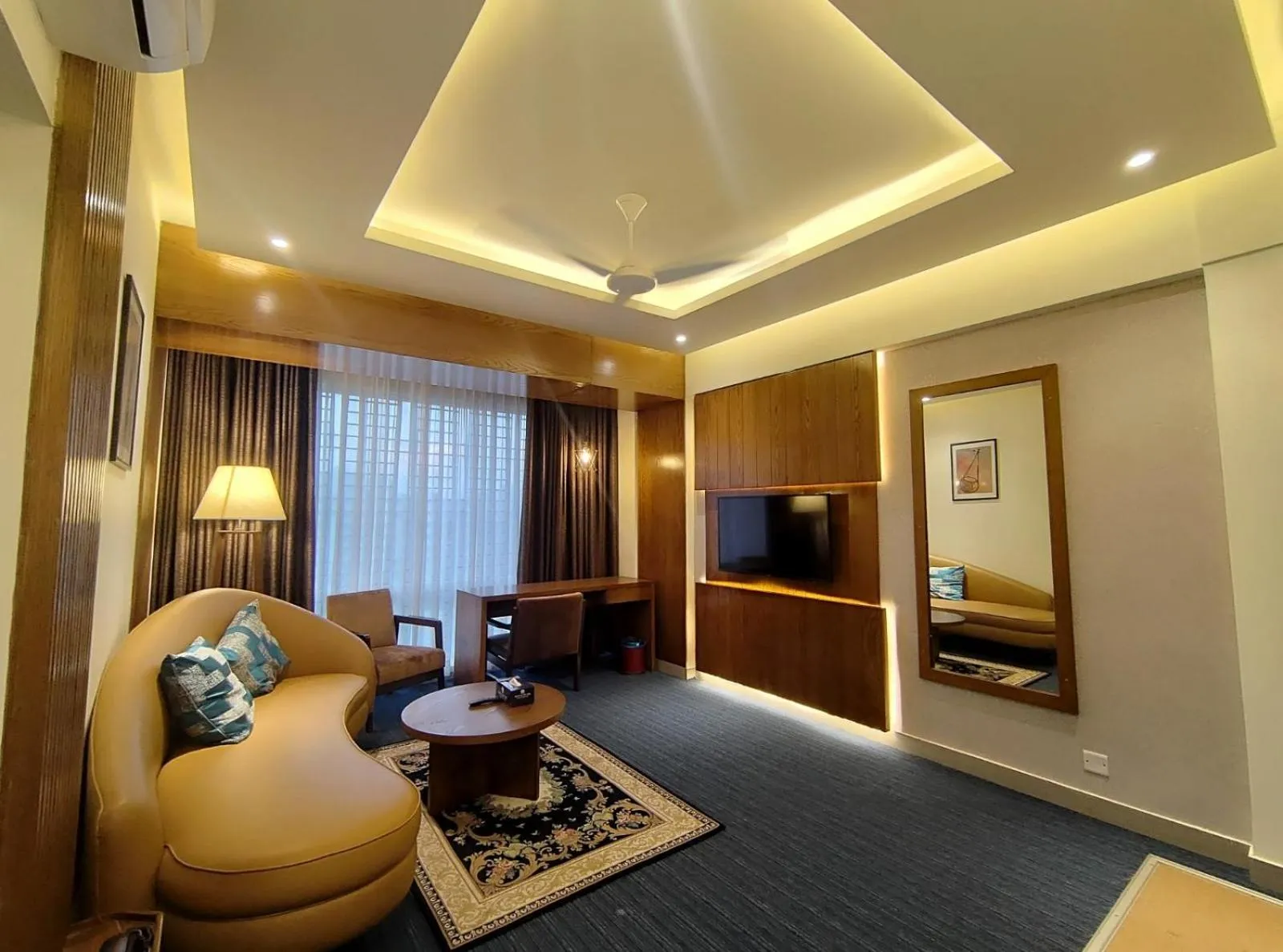 Seating area, Bed in Royal Pearl Suites