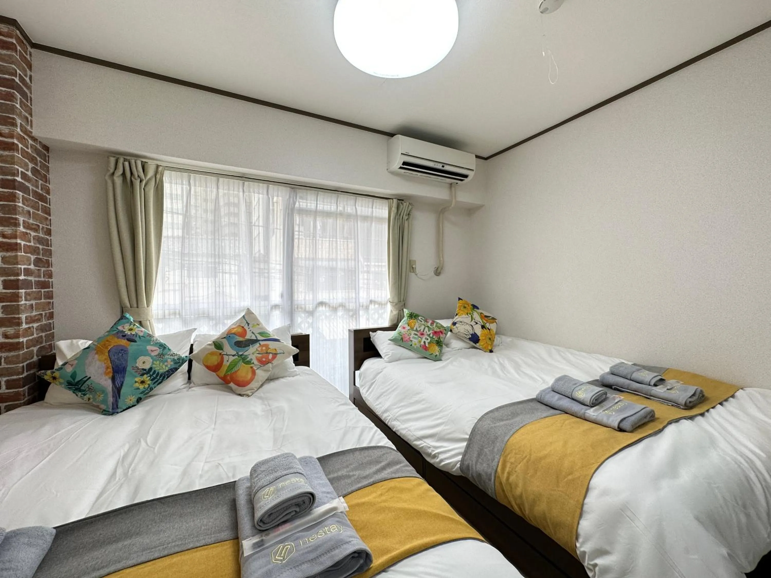 Bed in nestay apartment tokyo otsuka