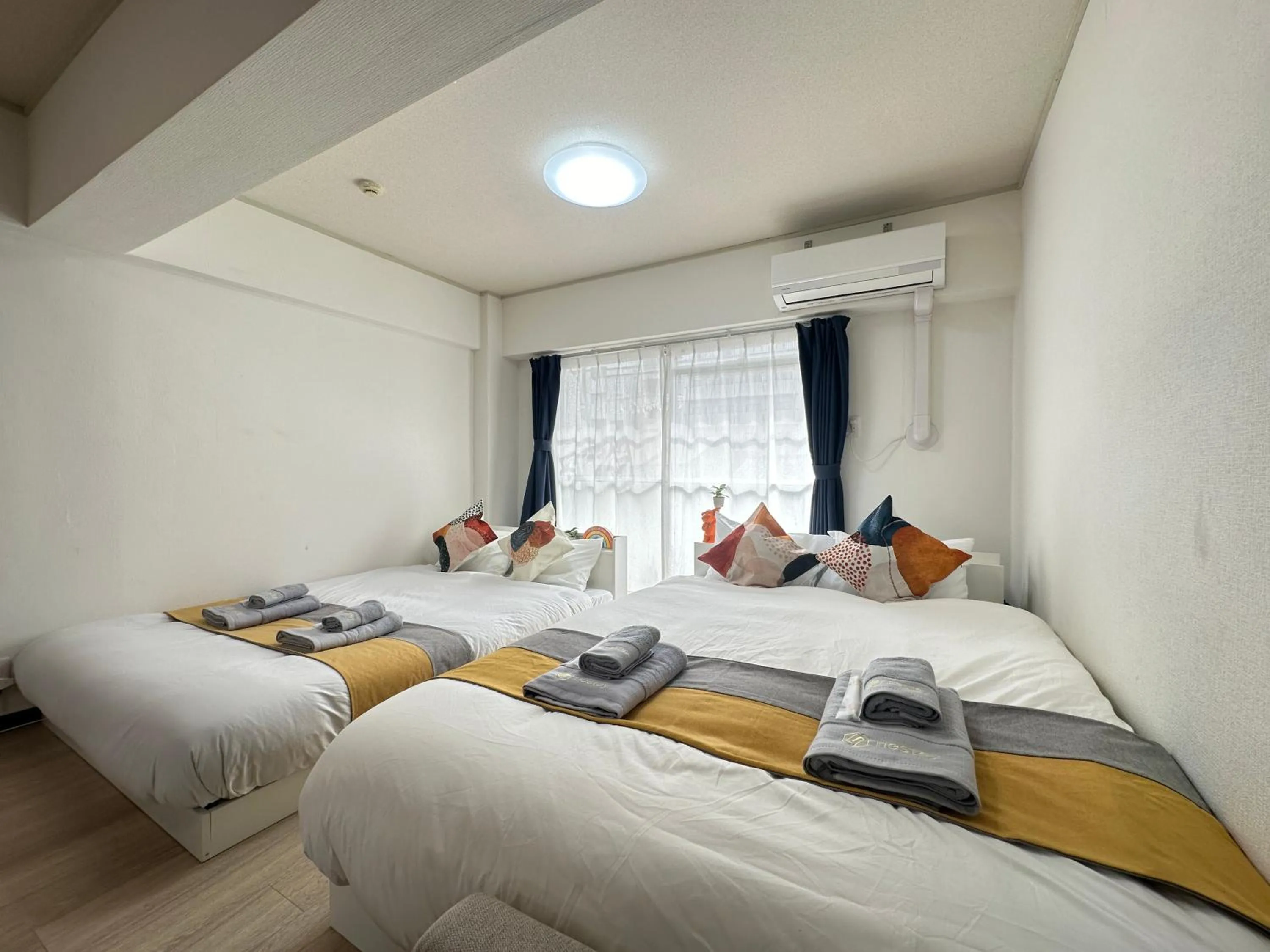 Bed in nestay apartment tokyo otsuka