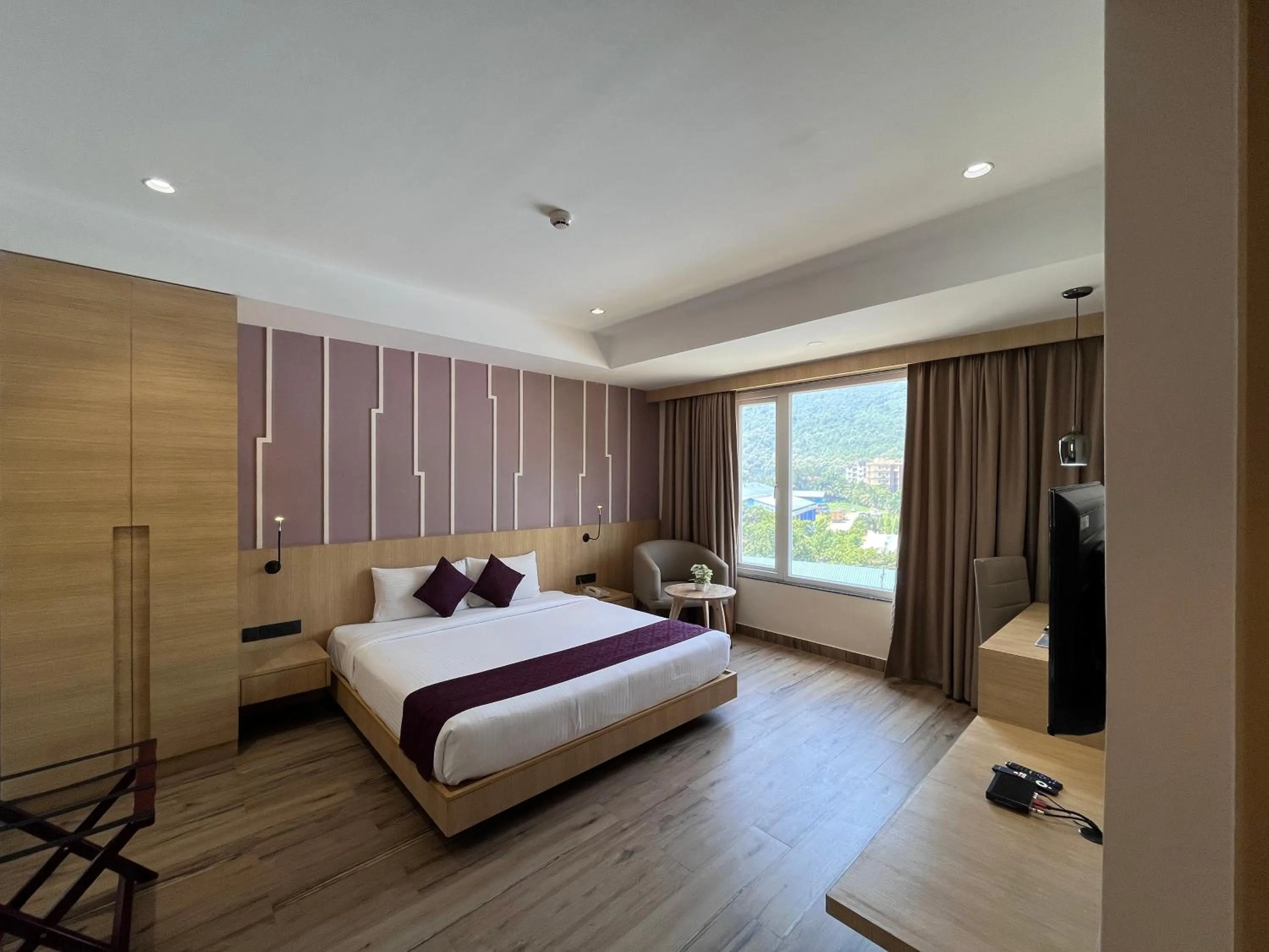 TV and multimedia, Bed in Sachika Hotels, Guwahati