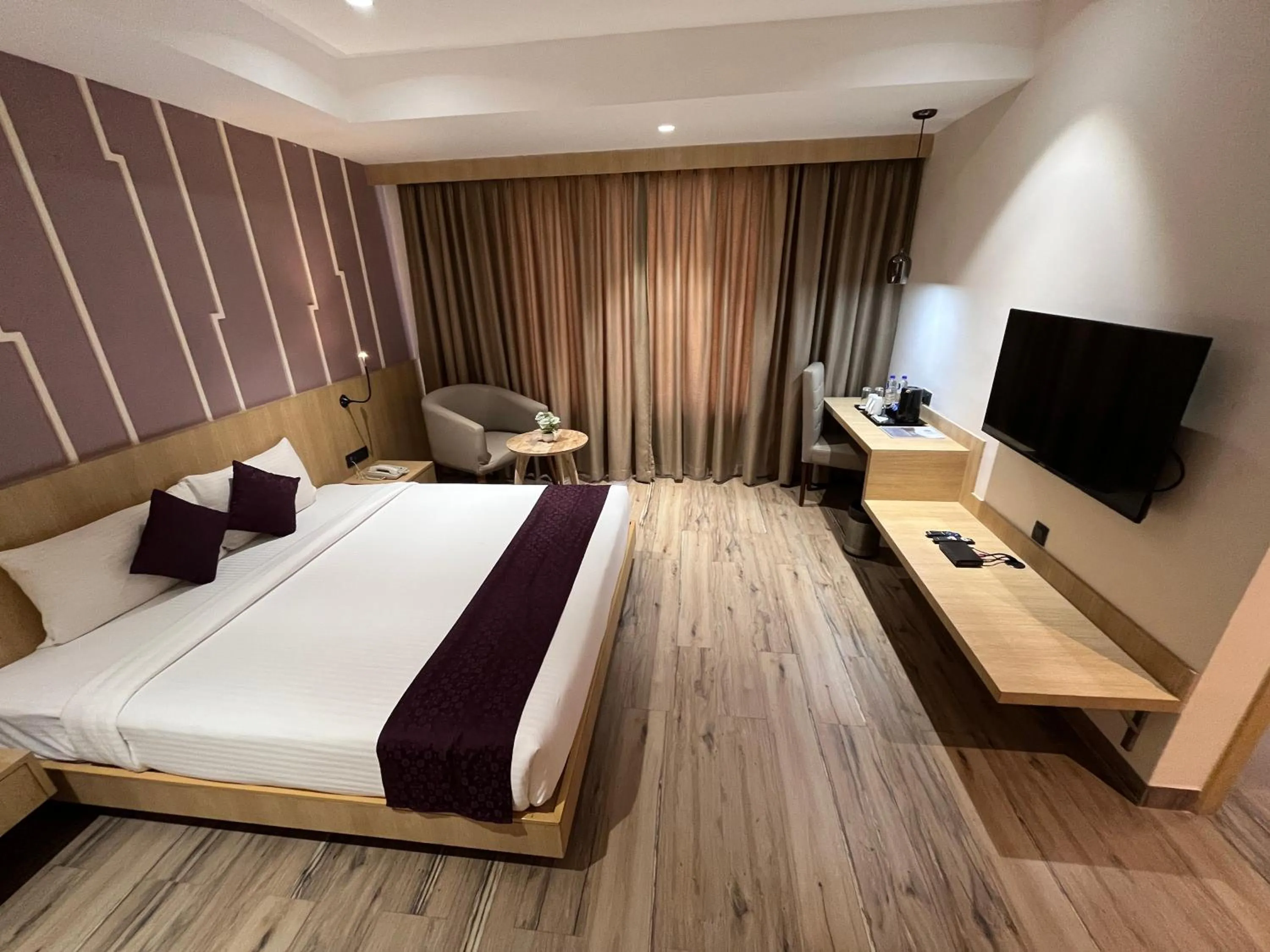 TV and multimedia, Bed in Sachika Hotels, Guwahati