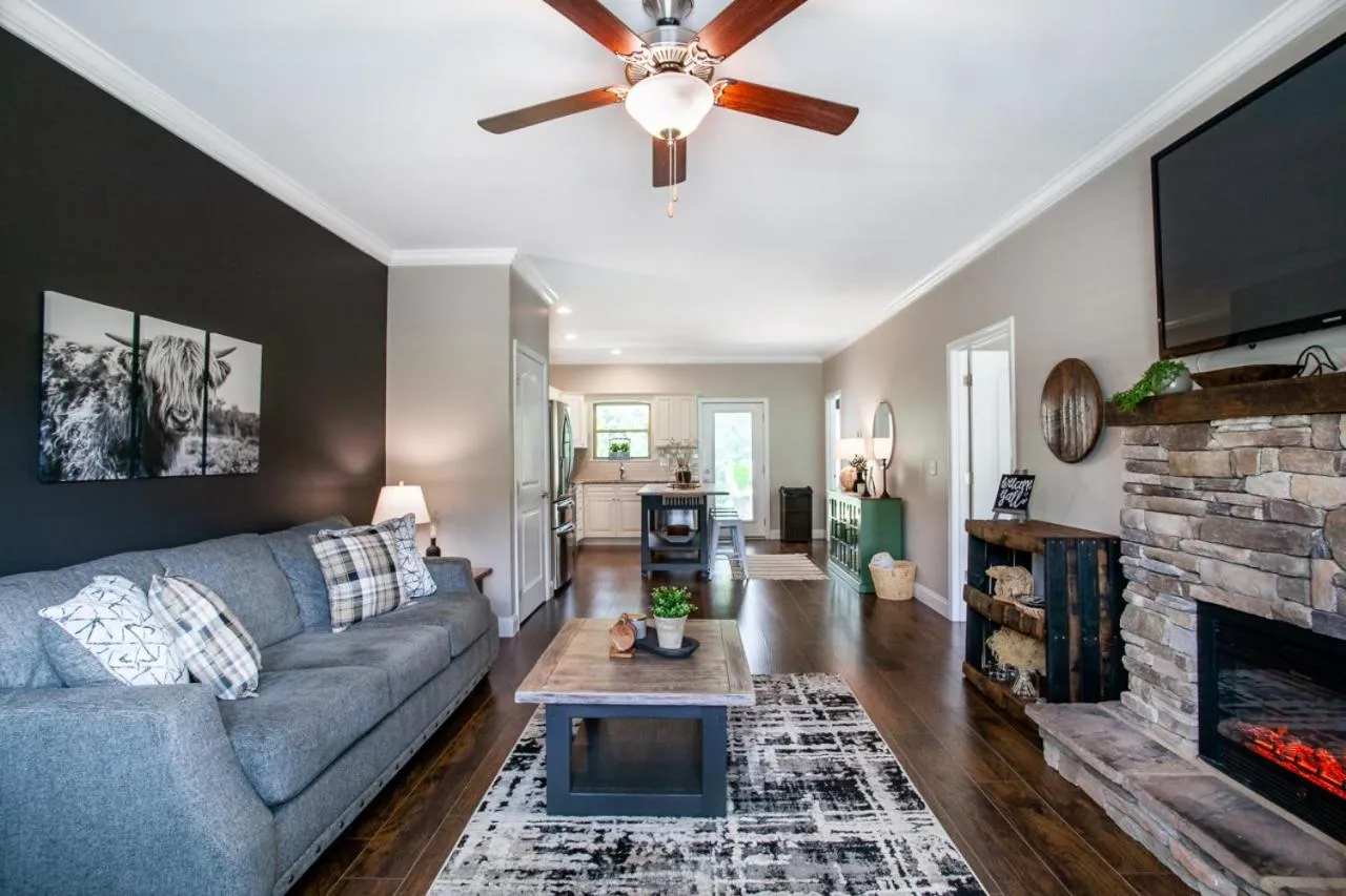 Living room in Elegant End Condo Fireplace Community Amenities