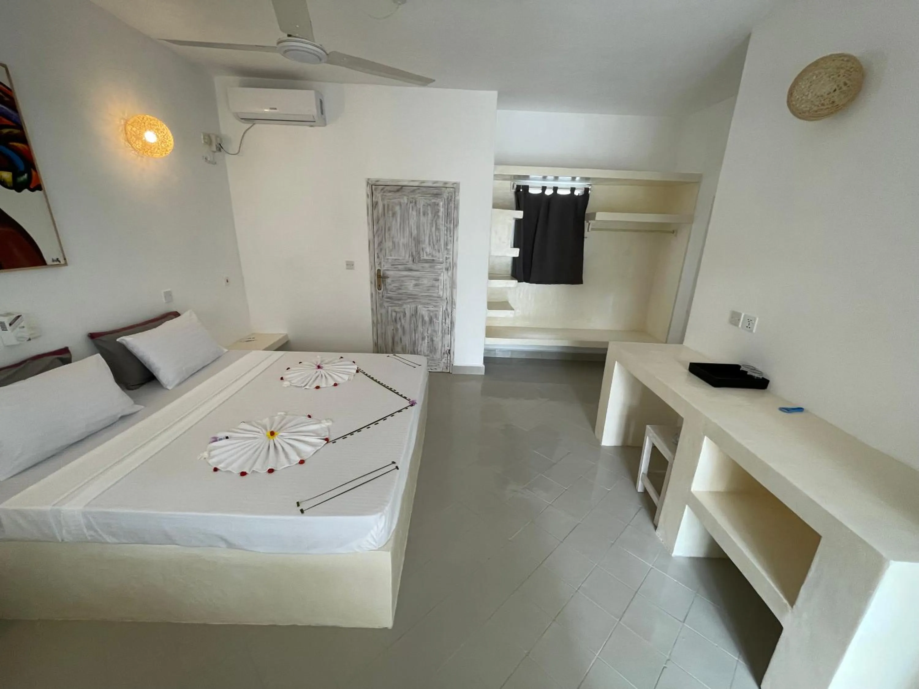 Bed in Ascot Watamu Resort