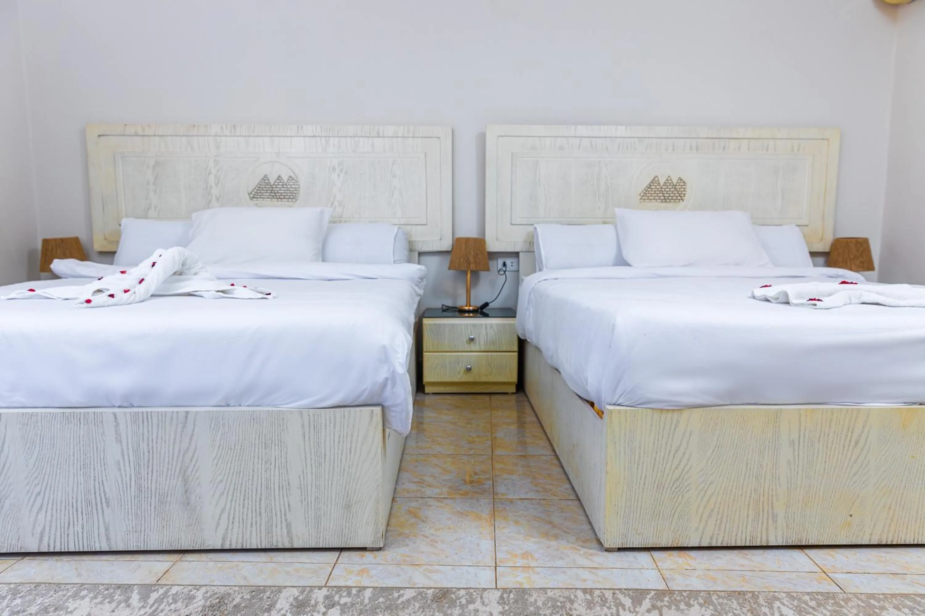 Bed in Pyramids Land Hotel