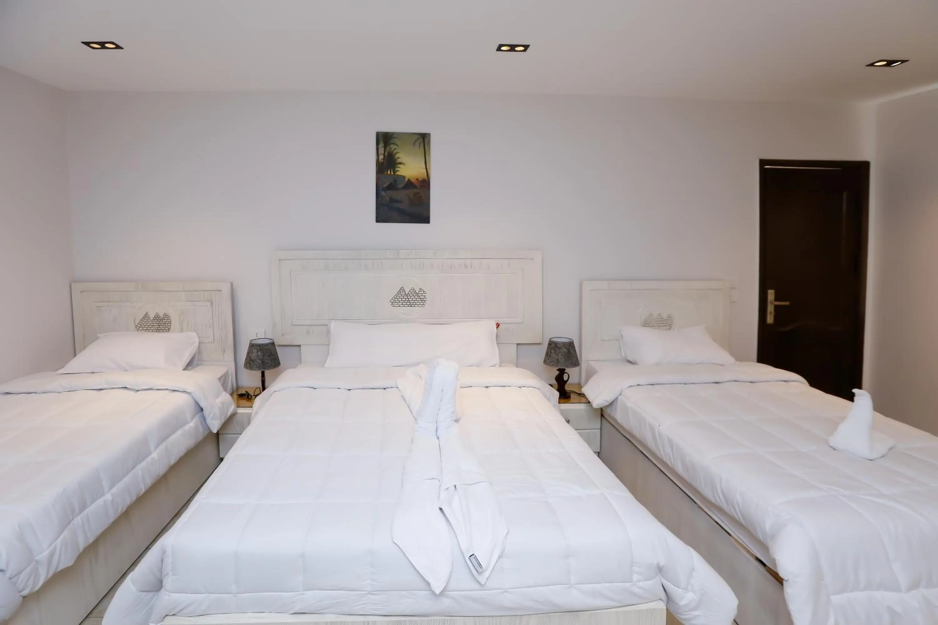 Bed in Pyramids Land Hotel