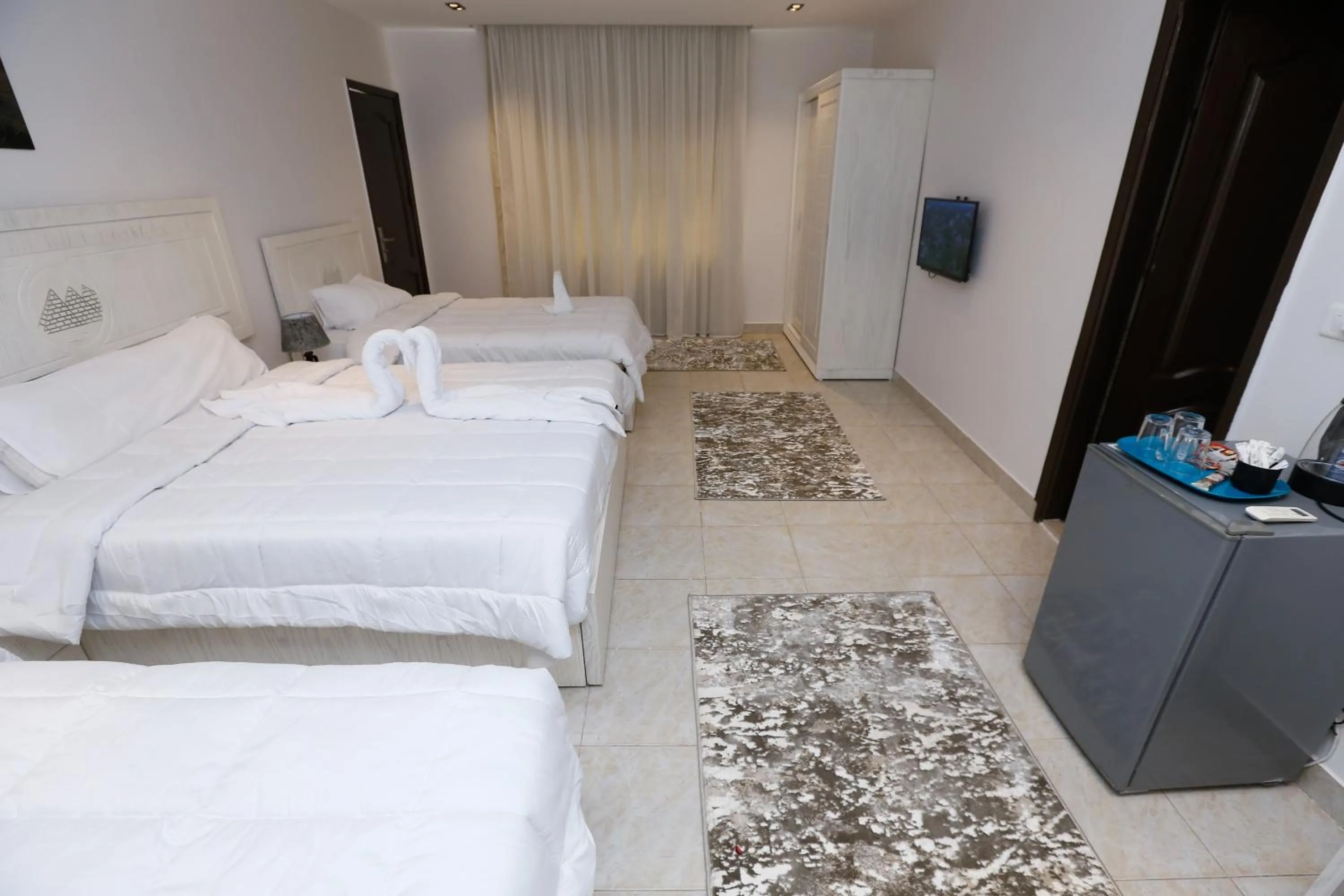 Bed in Pyramids Land Hotel