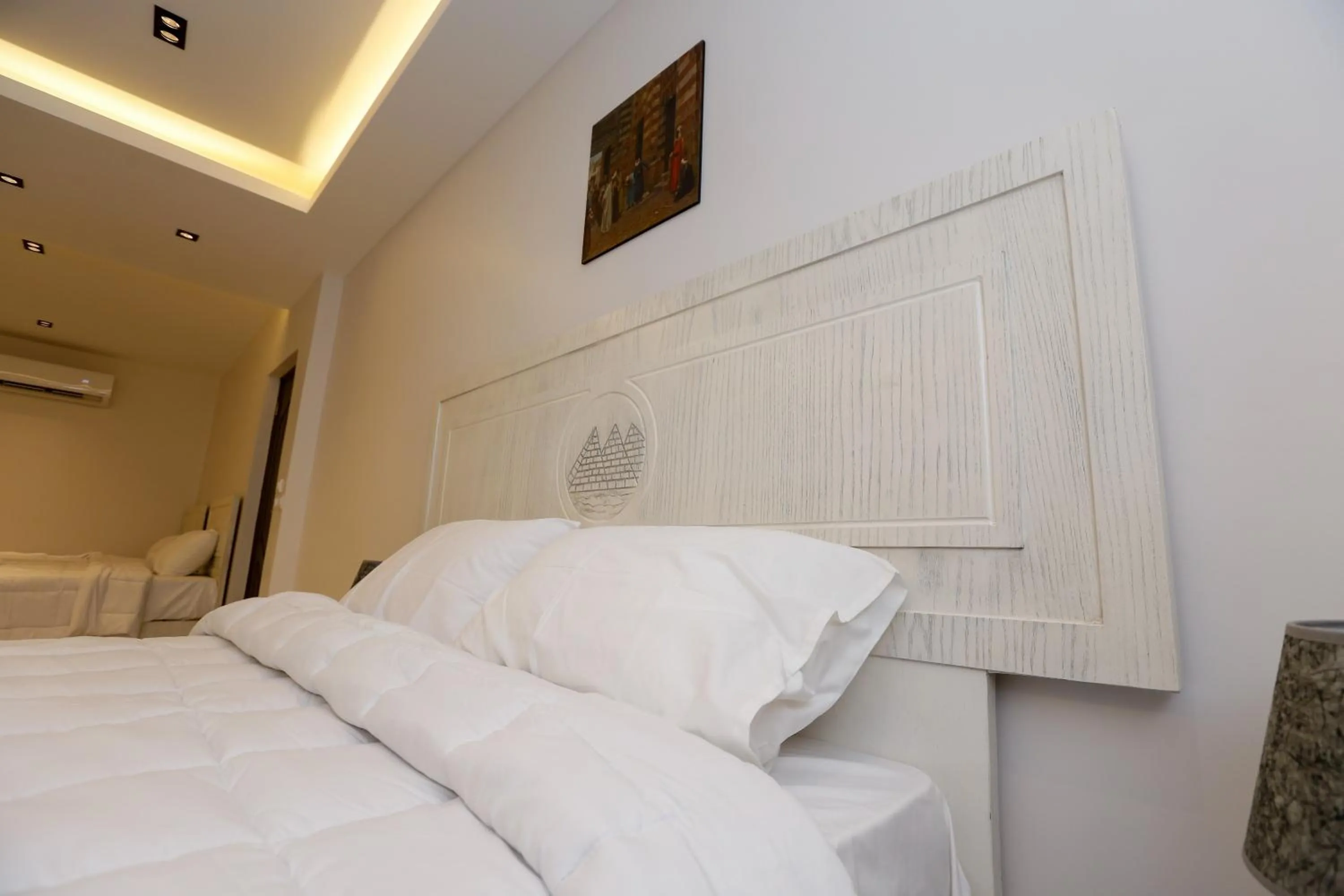 Bed in Pyramids Land Hotel