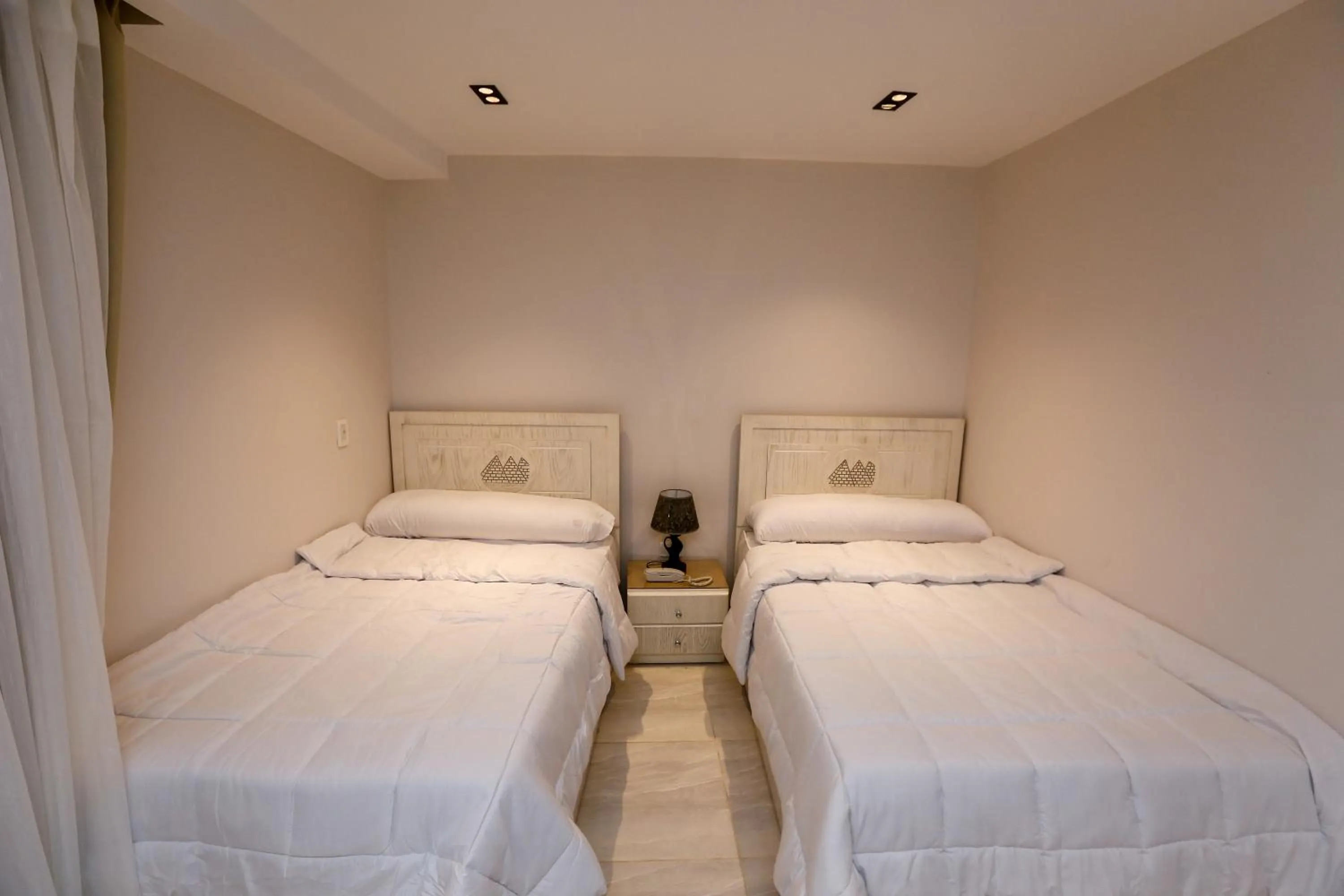 Bed in Pyramids Land Hotel