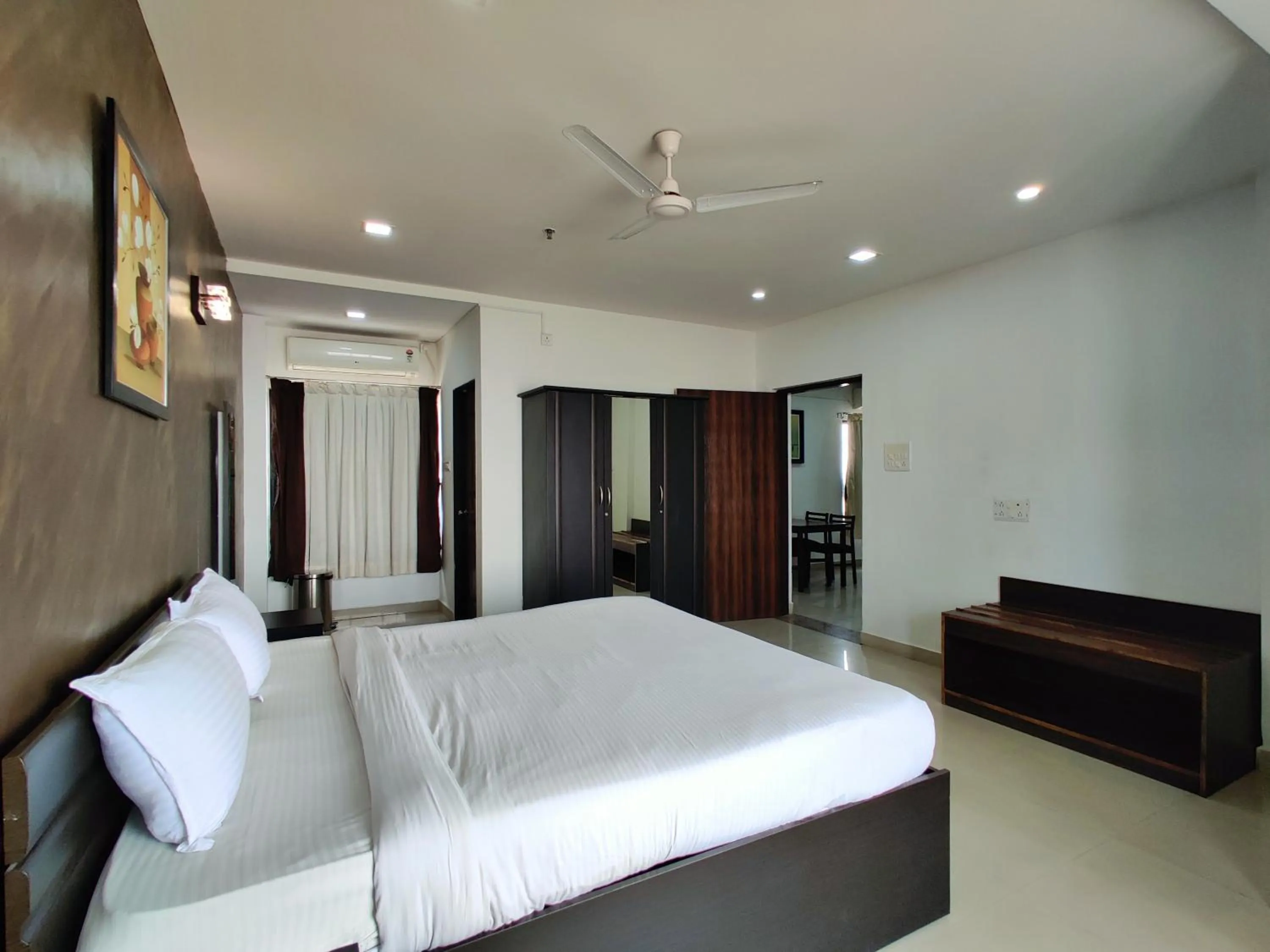 Bed in Golden Chariot Hotel Daman