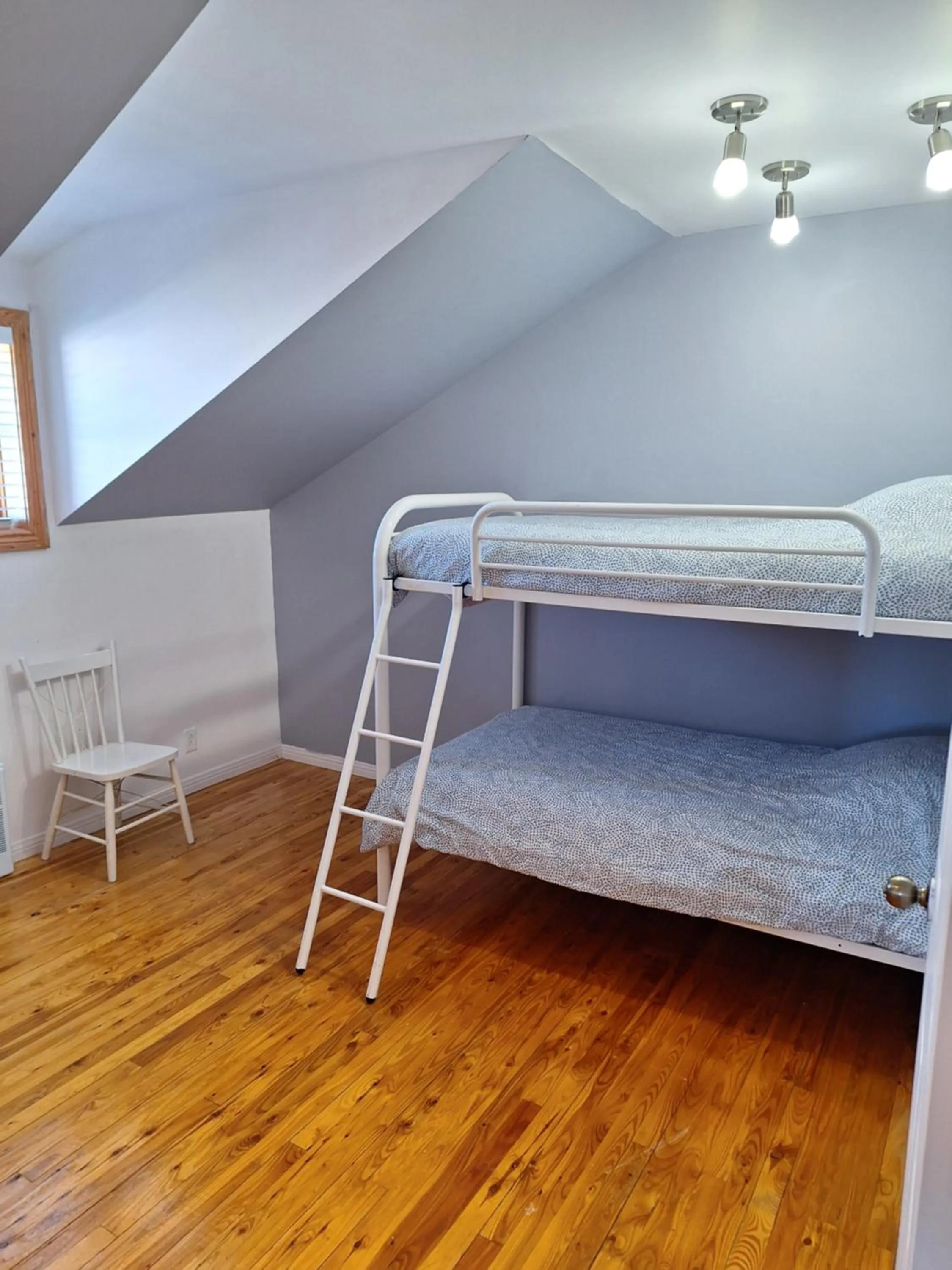 Bed in Auberge Le P'tit Bonheur