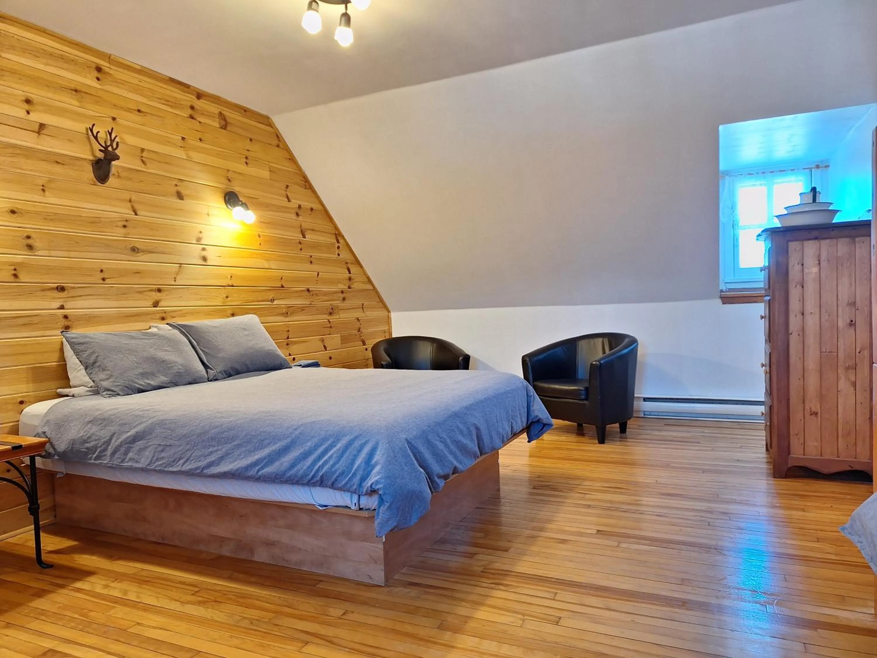 Bed in Auberge Le P'tit Bonheur