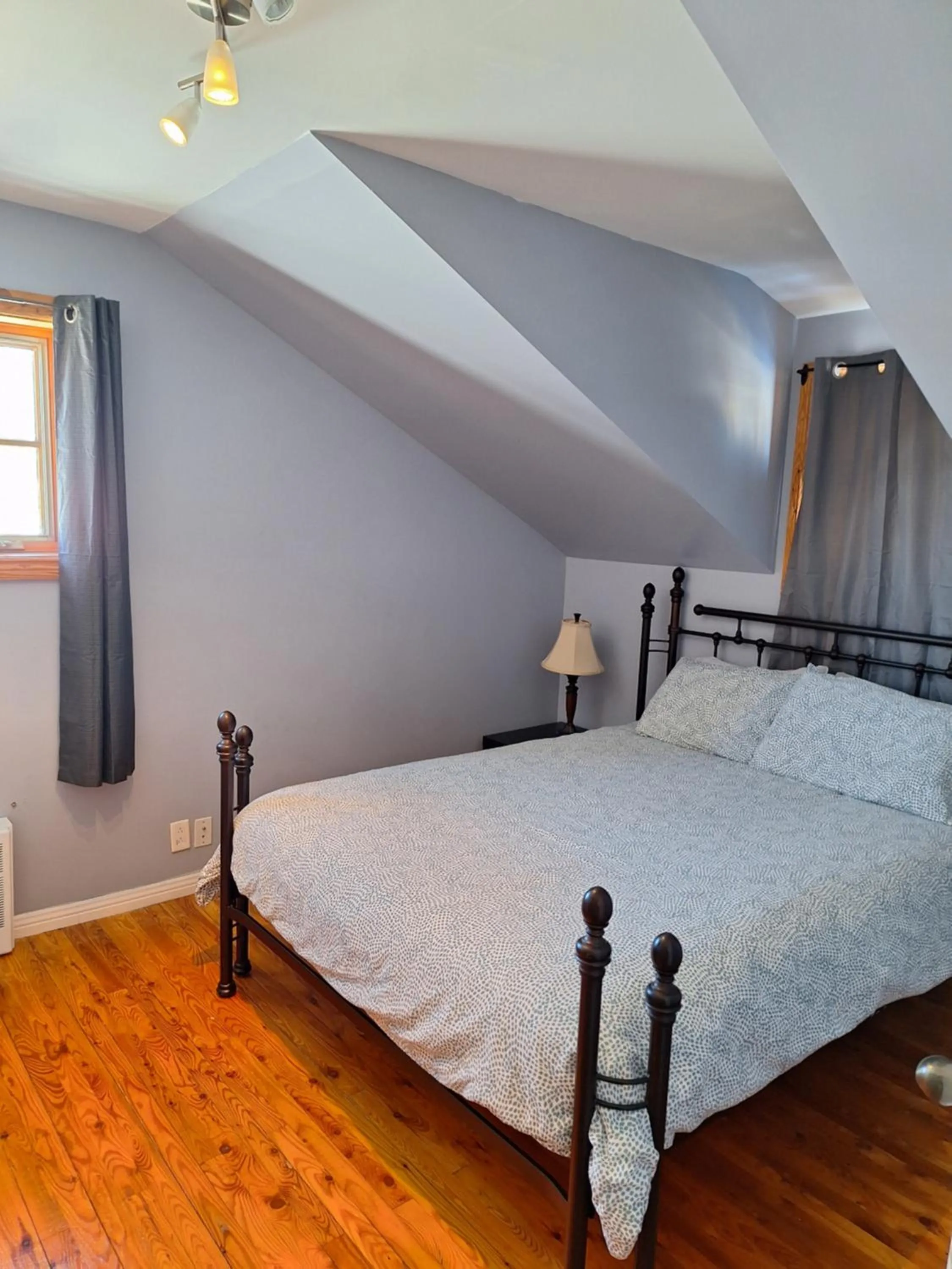 Bed in Auberge Le P'tit Bonheur