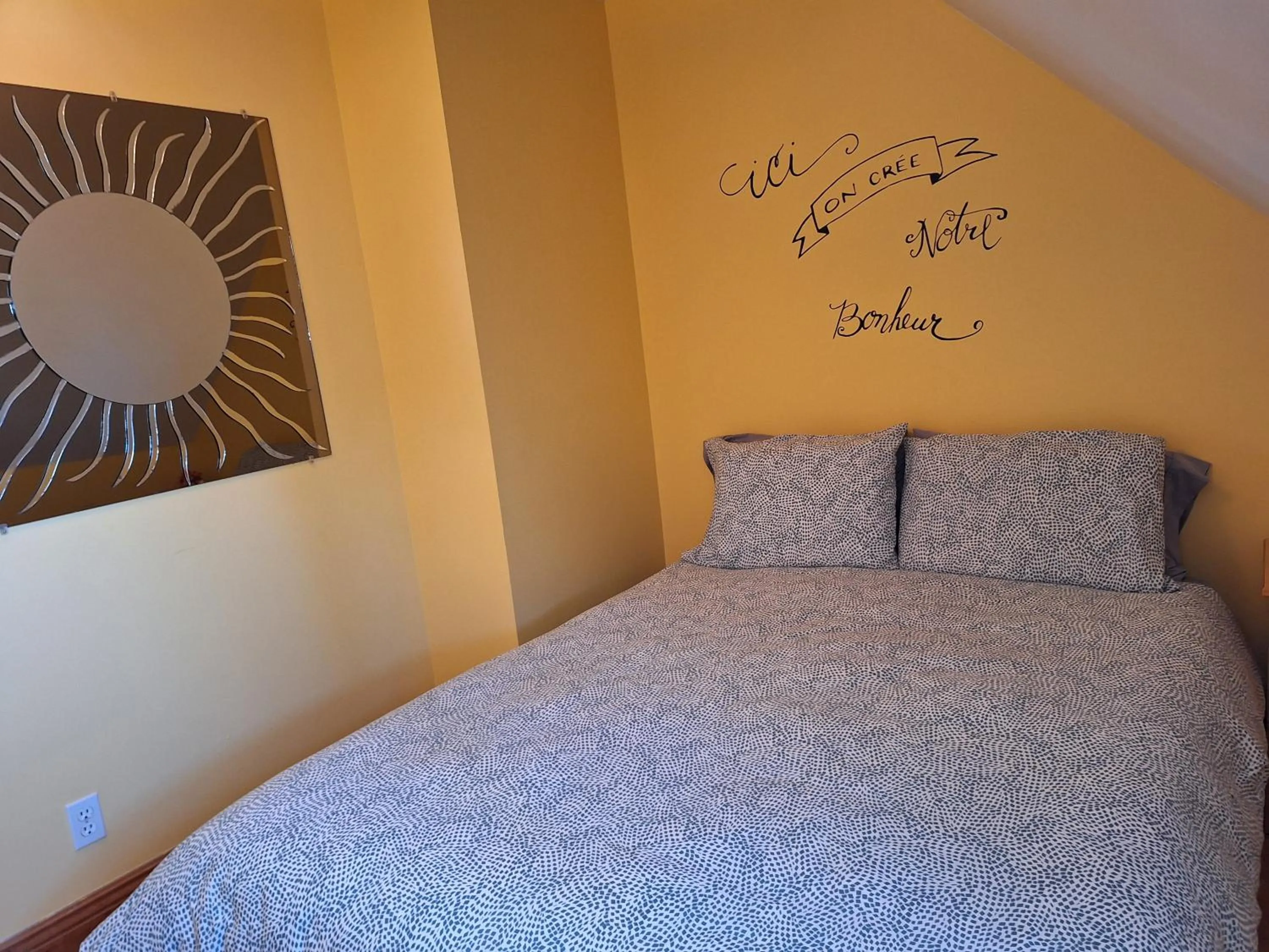 Bed in Auberge Le P'tit Bonheur