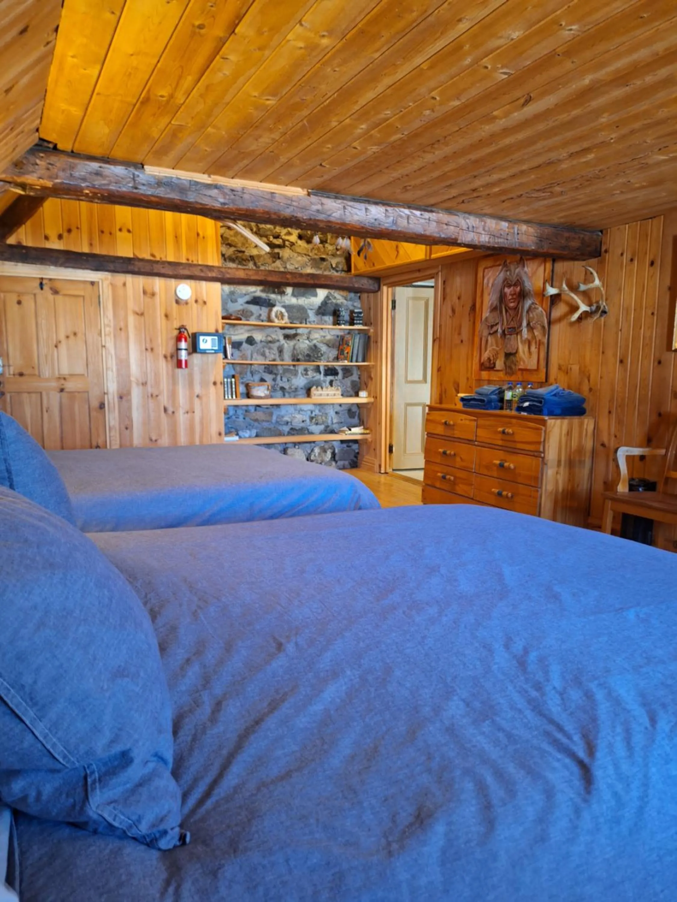 Bed in Auberge Le P'tit Bonheur