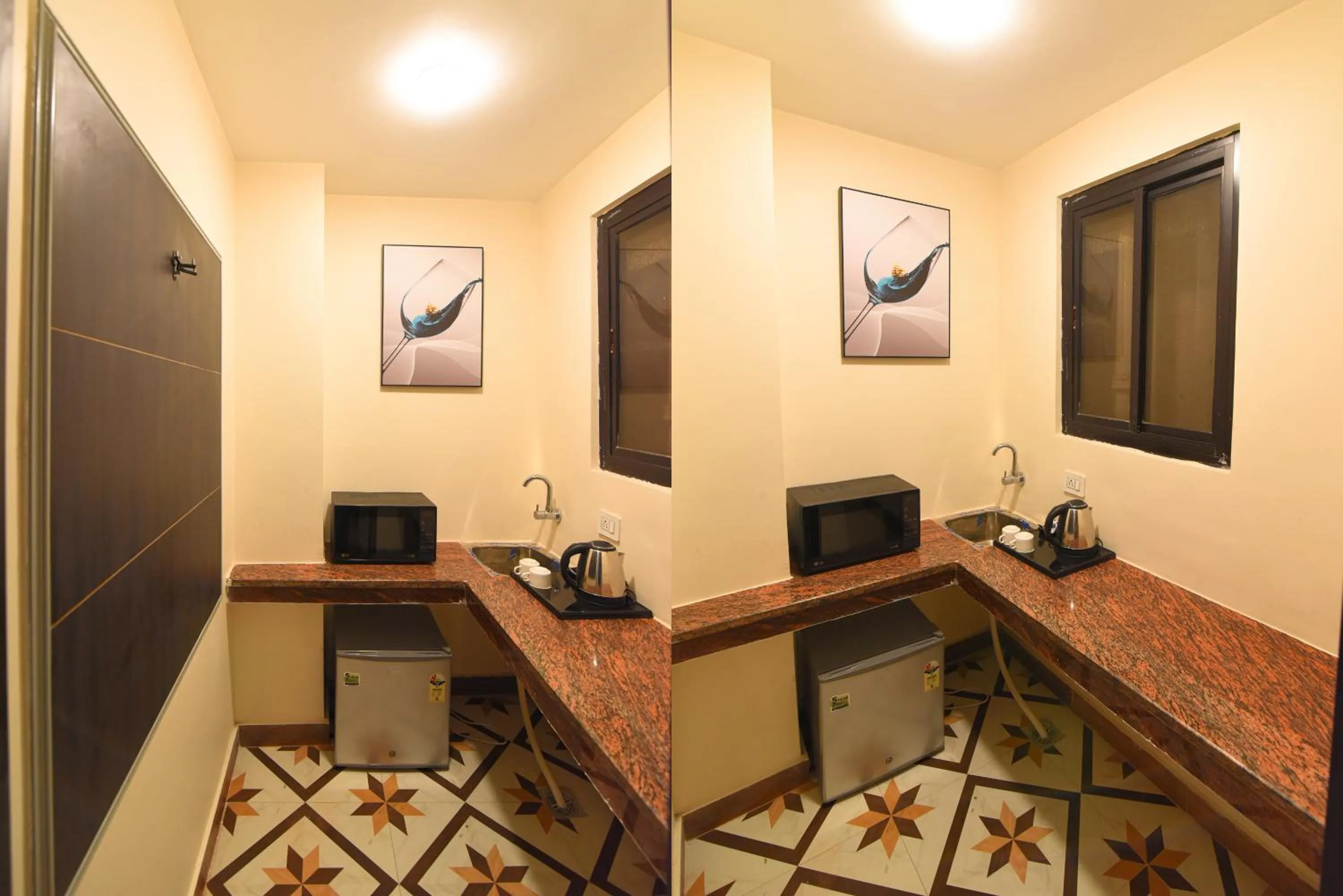 Kitchen or kitchenette in Hotel Swagat Suites