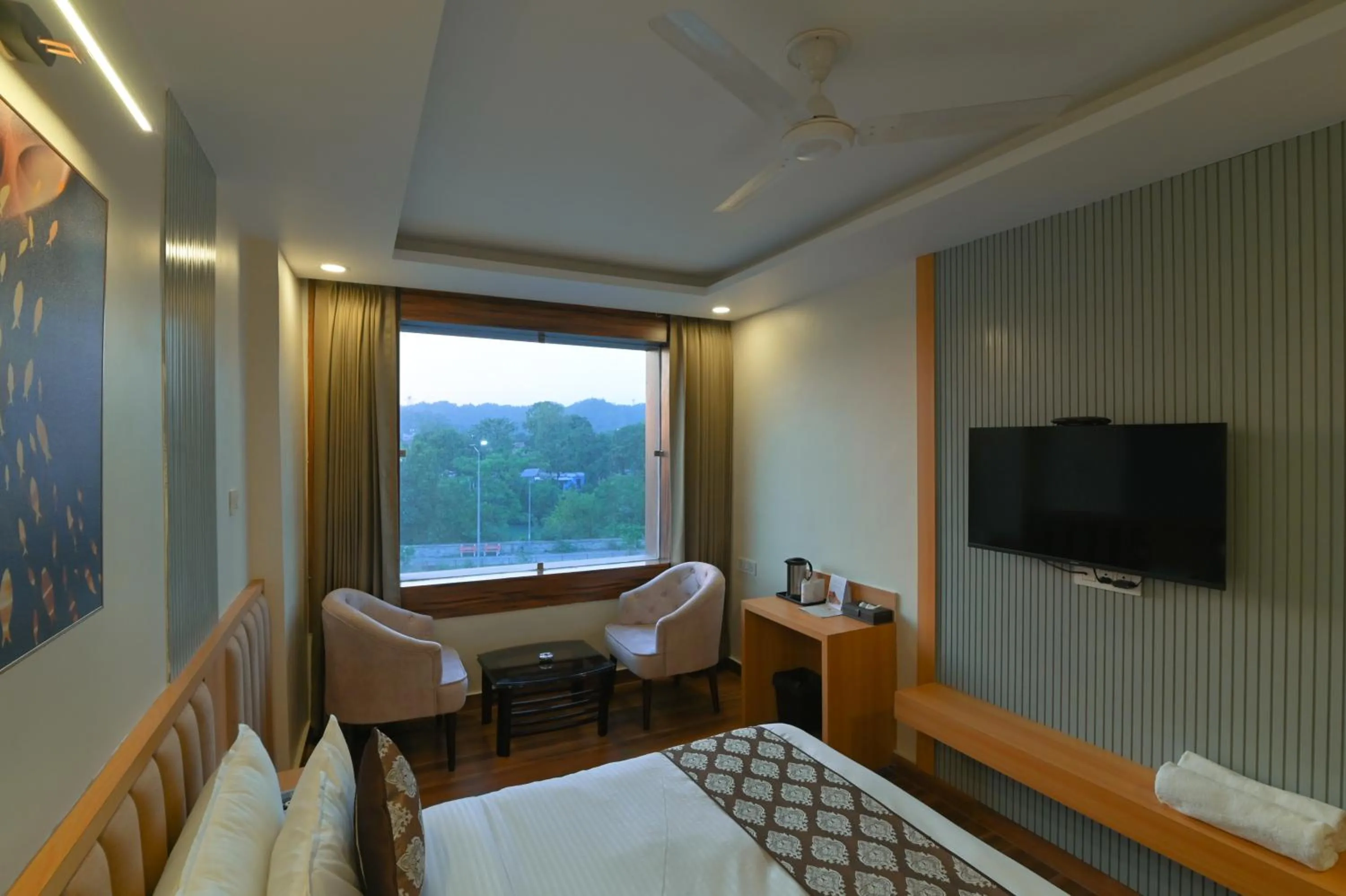River view, Bed in Hotel Swagat Suites