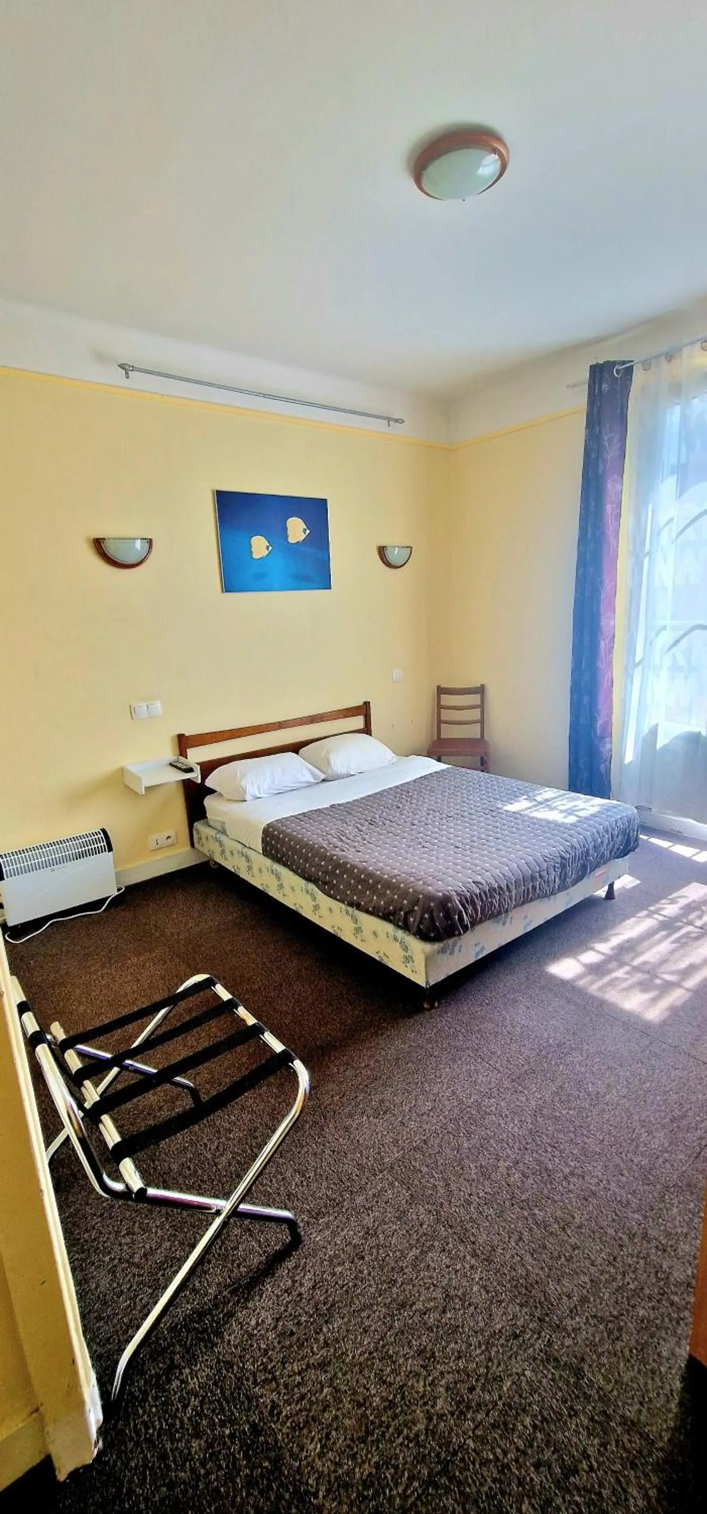 Bed in Hôtel de la cloche