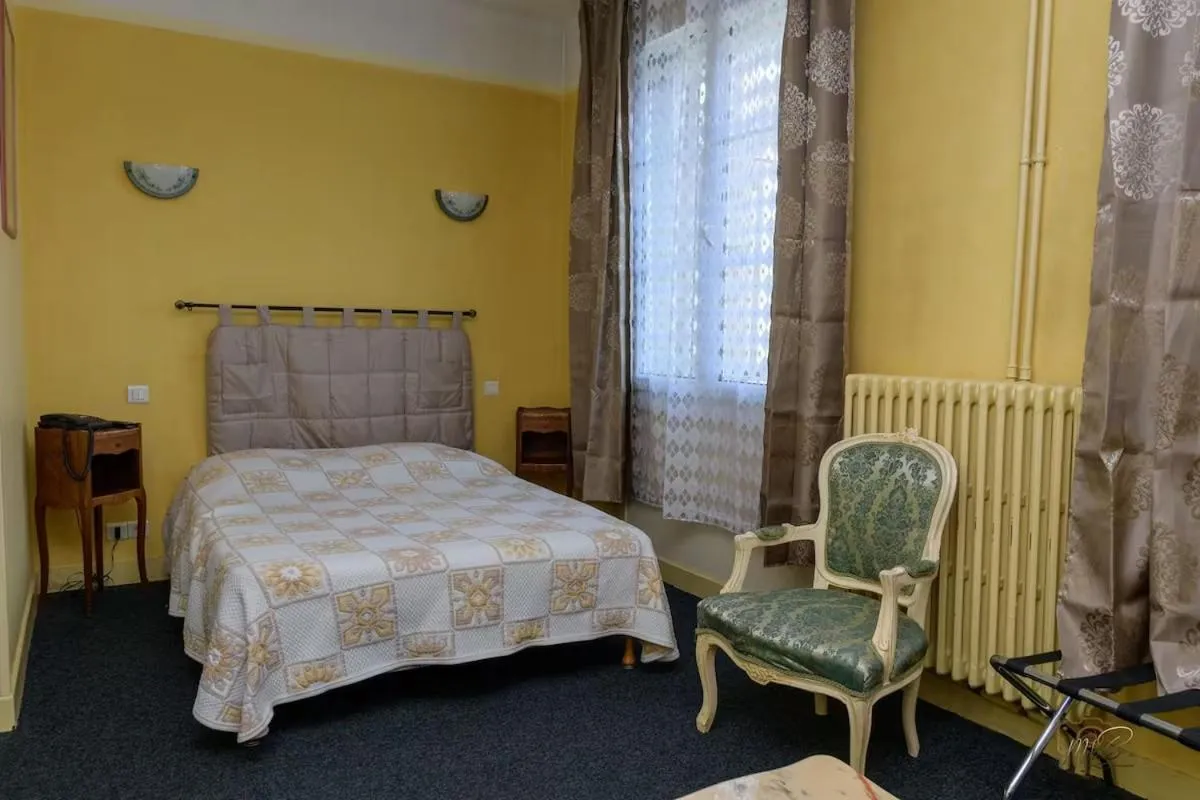 Bed in Hôtel de la cloche