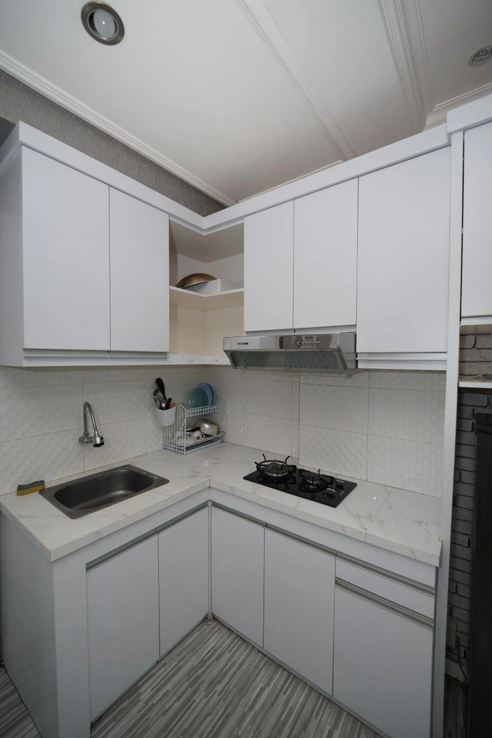 kitchen in Perfect Stay Apartement The Suites Metro Bandung By Sultan Property