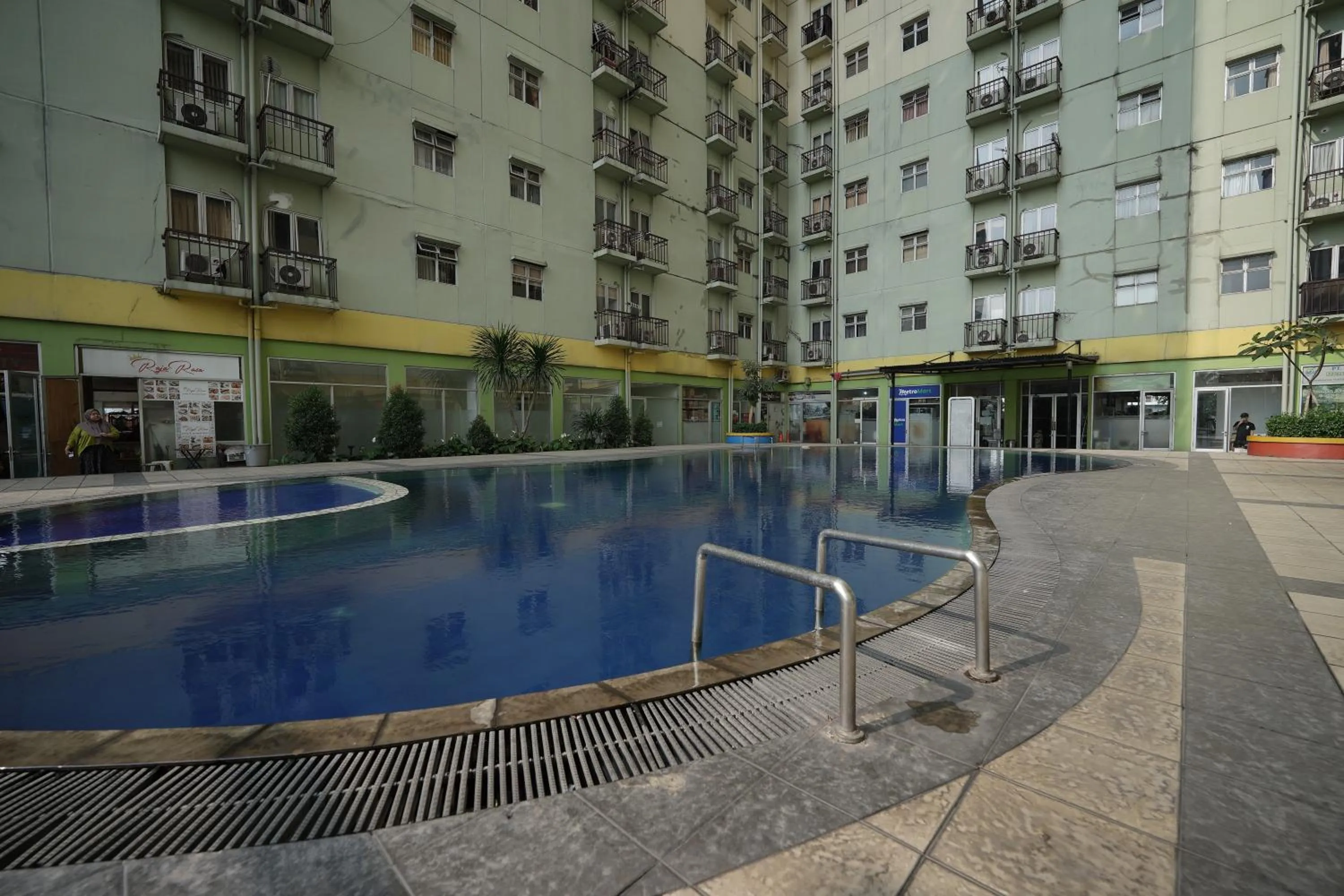 Swimming pool in Perfect Stay Apartement The Suites Metro Bandung By Sultan Property
