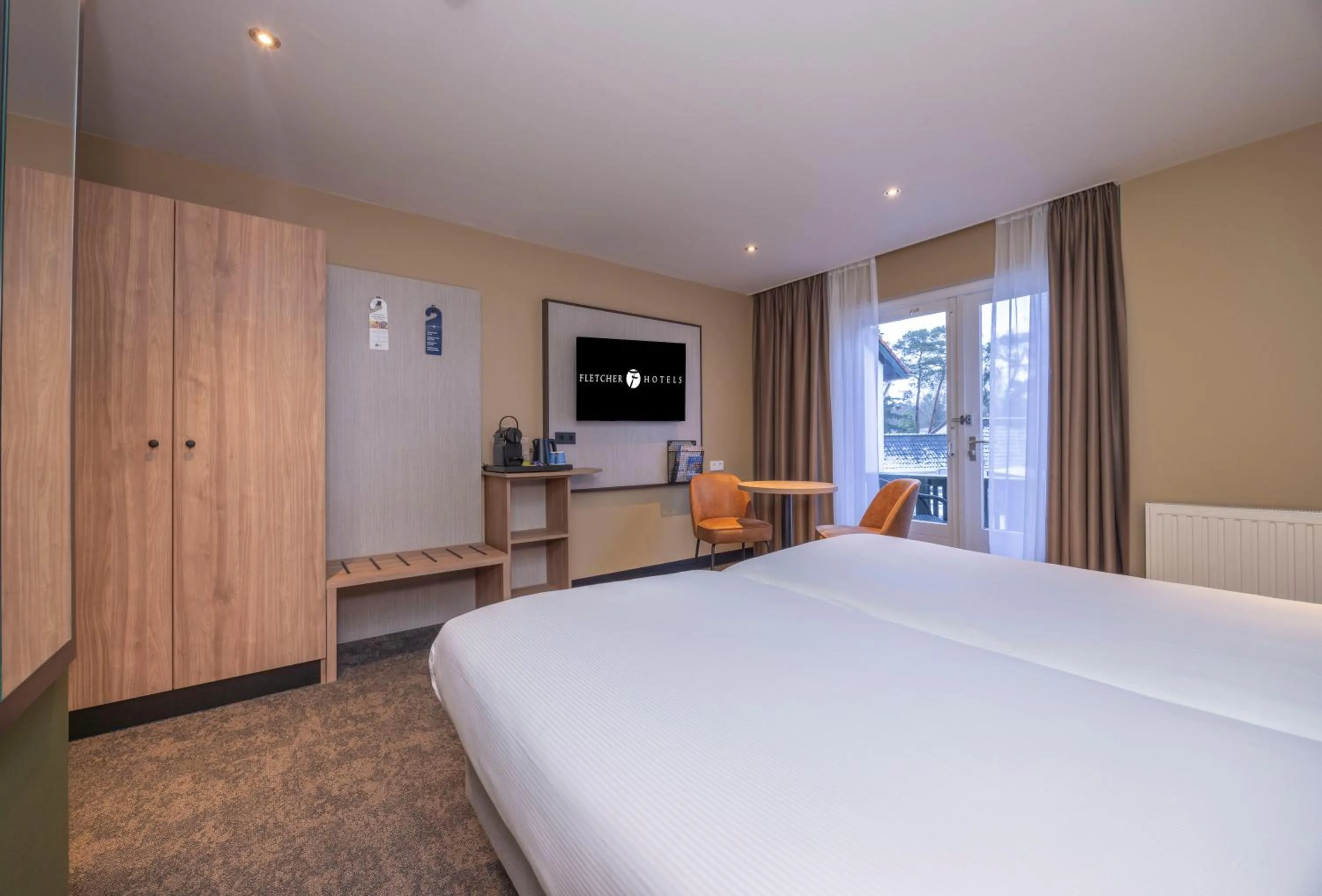 Bed in Fletcher Hotel-Restaurant Klein Zwitserland