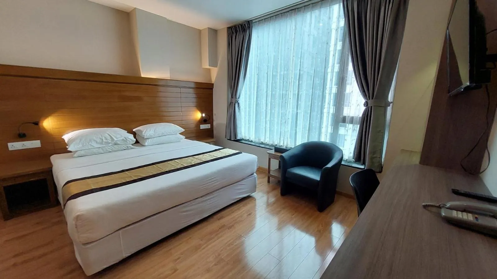 Bed in Hotel Grand Galaxy