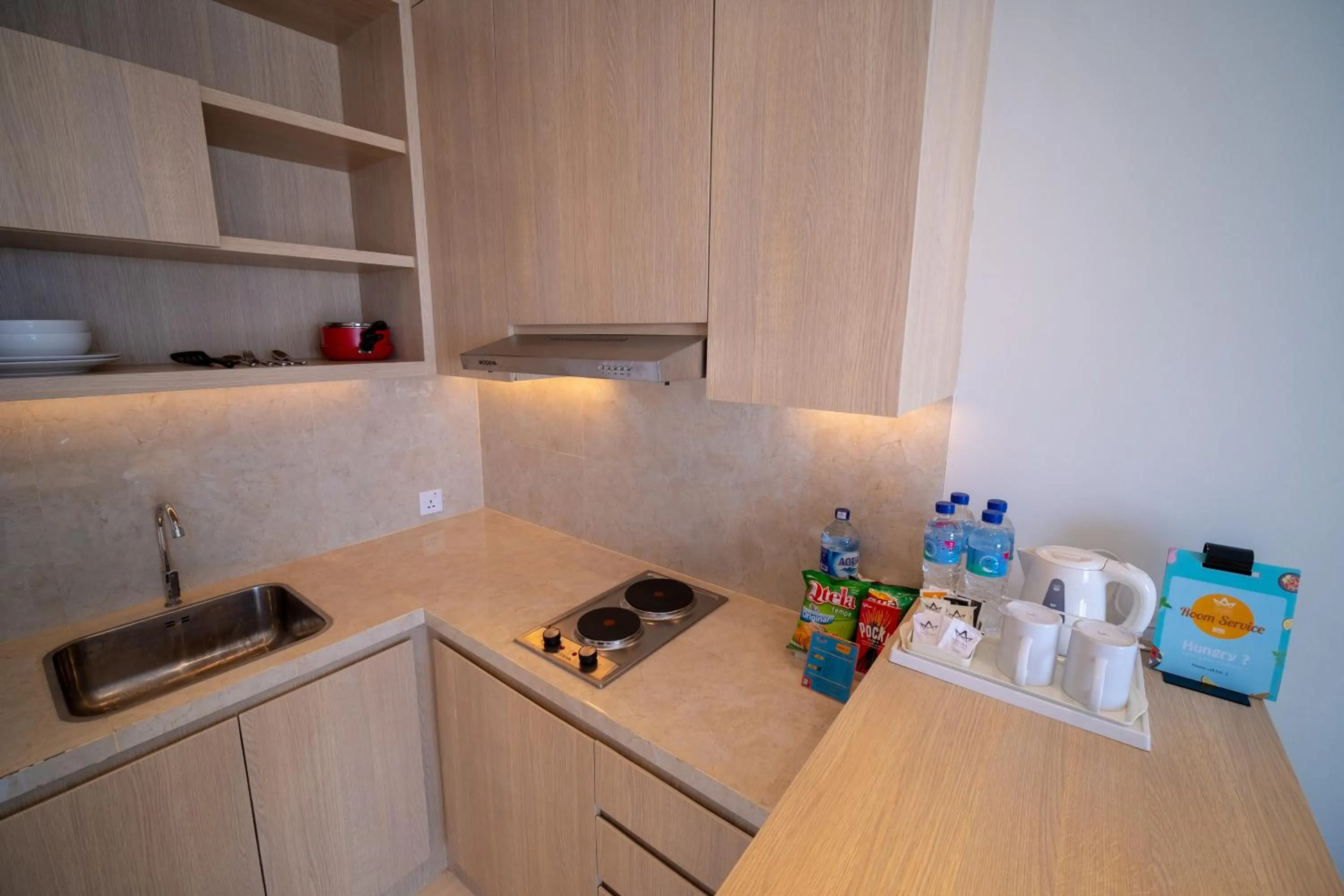 Kitchen or kitchenette in Astara Hotel Balikpapan