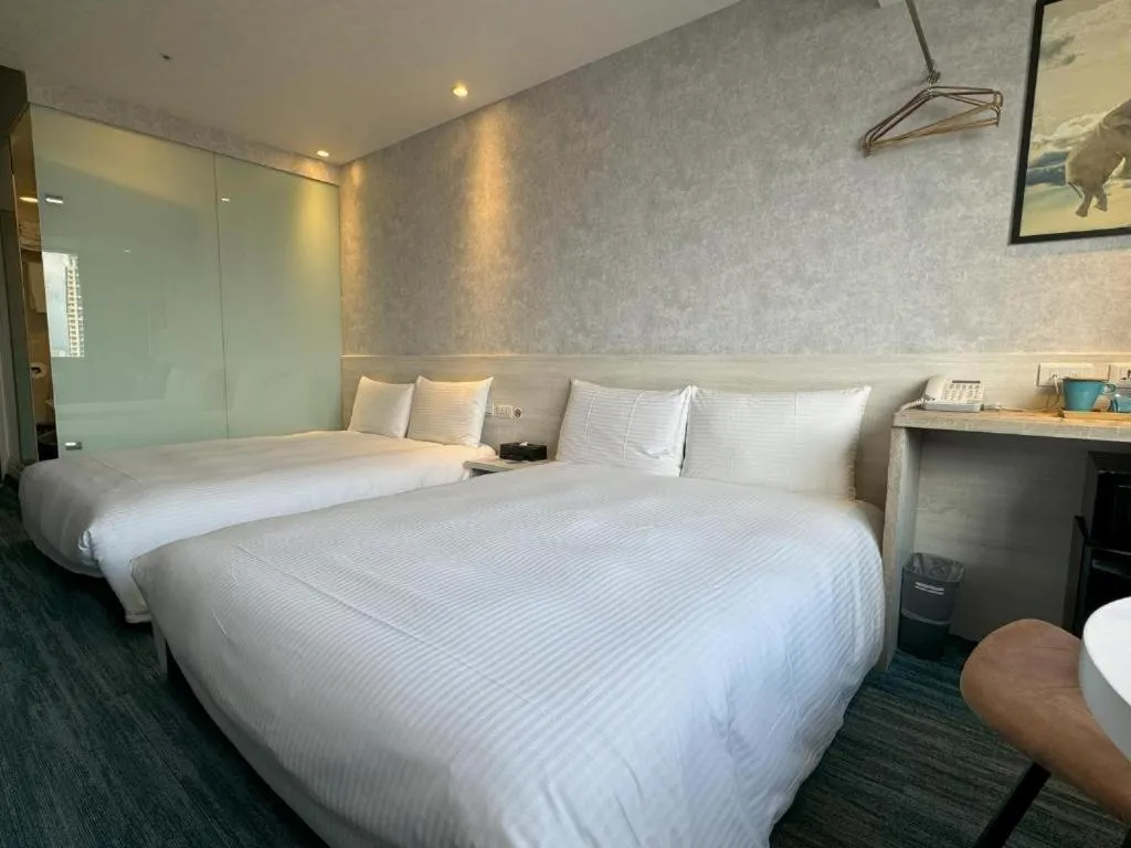 Bed in 西門雲町旅店 Sky Gate Hotel