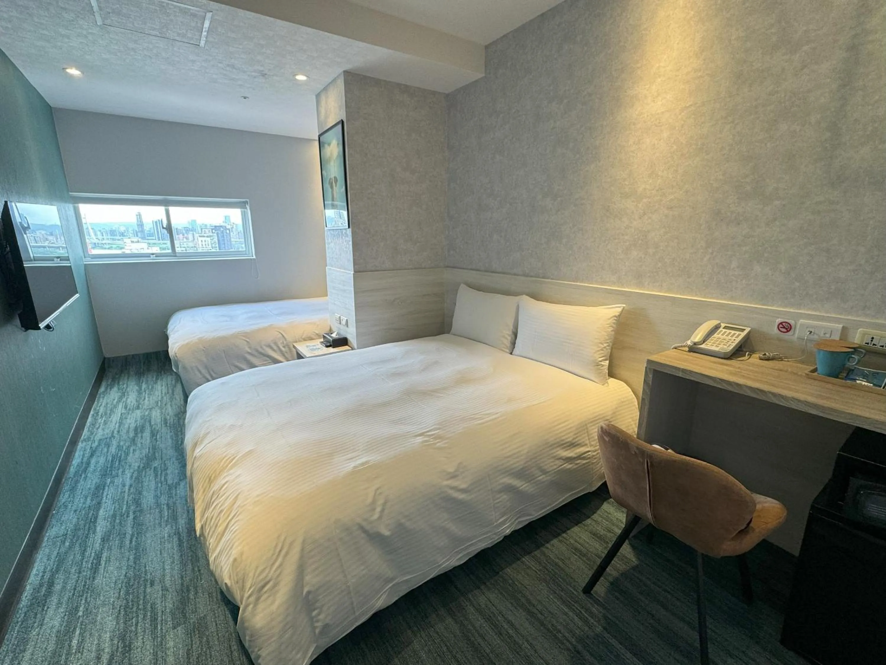 Bed in 西門雲町旅店 Sky Gate Hotel