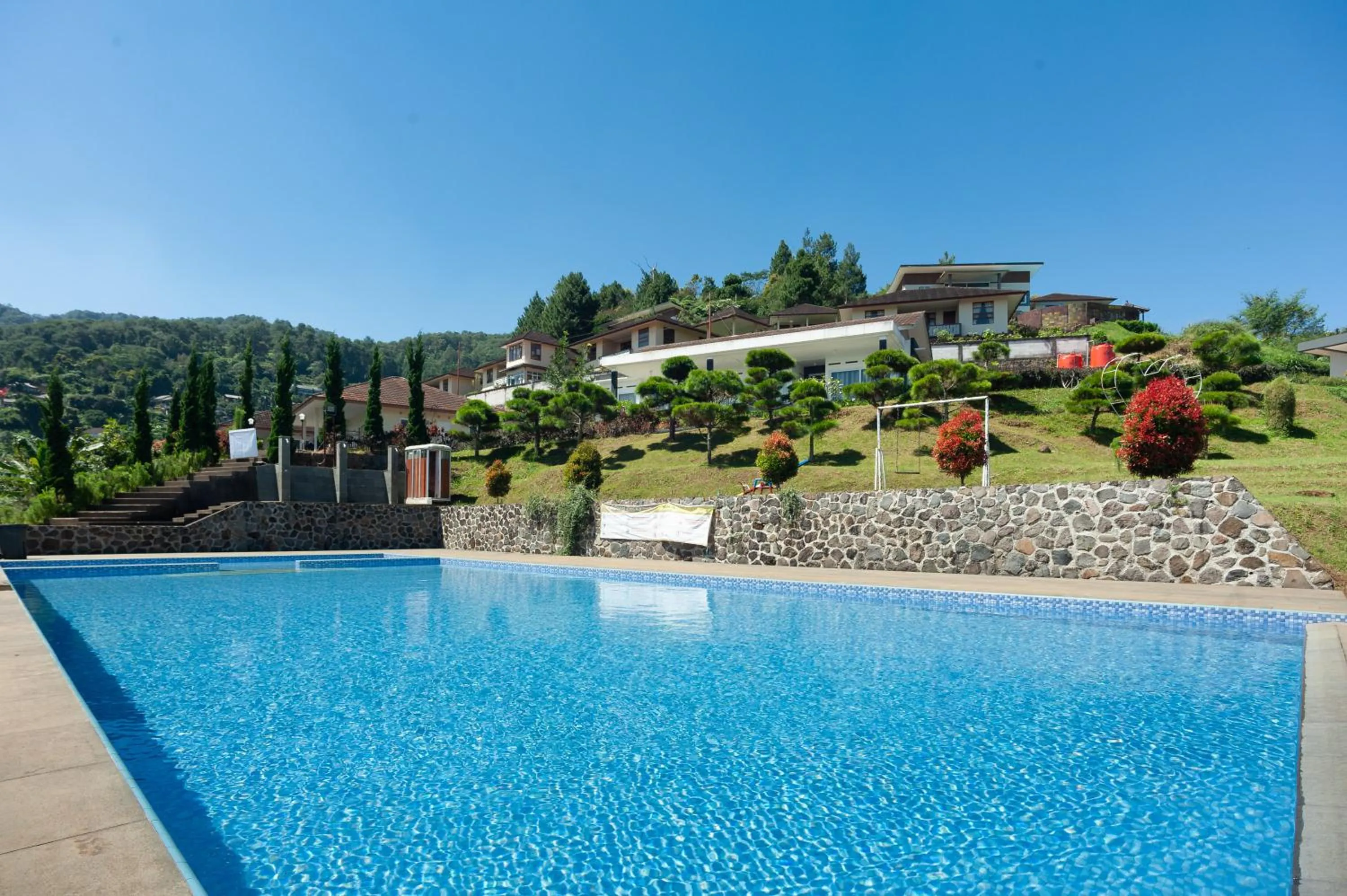 Swimming pool in Urbanview Resort Adang Zecky Cisarua Puncak by RedDoorz