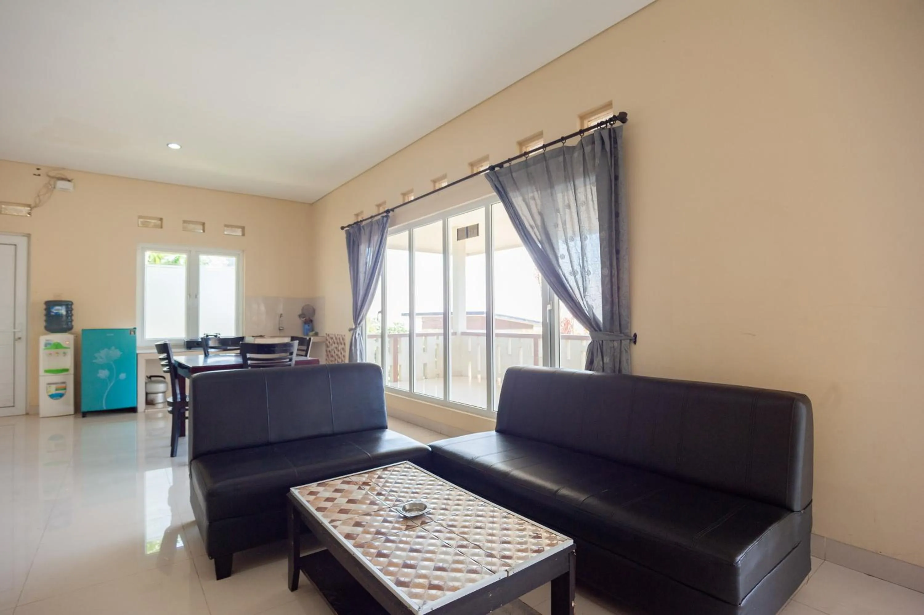 Living room in Urbanview Resort Adang Zecky Cisarua Puncak by RedDoorz