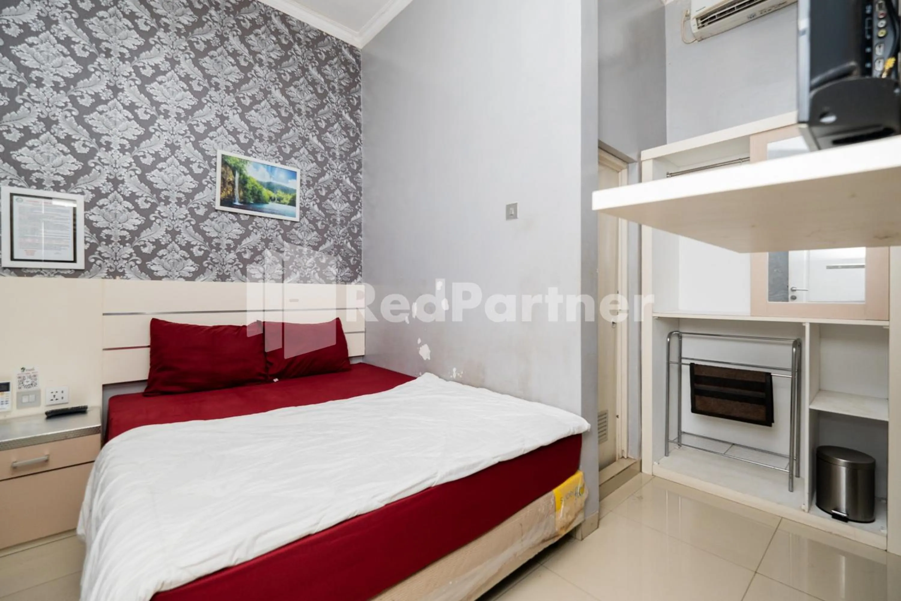 Bed in Omah Kalimosodo Mitra RedDoorz near Stasiun Malang Kota Baru