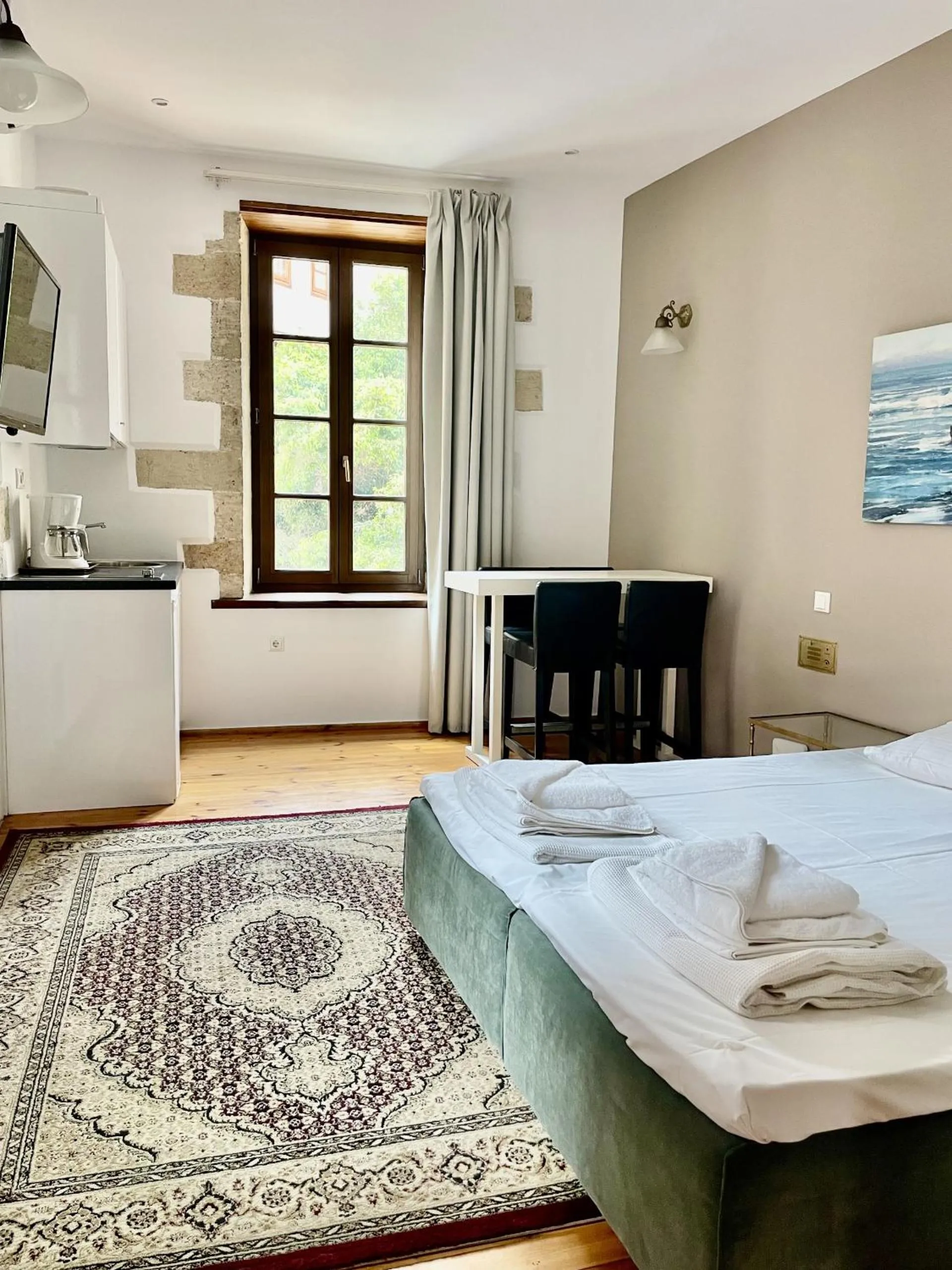 Bed in Erietta Suites