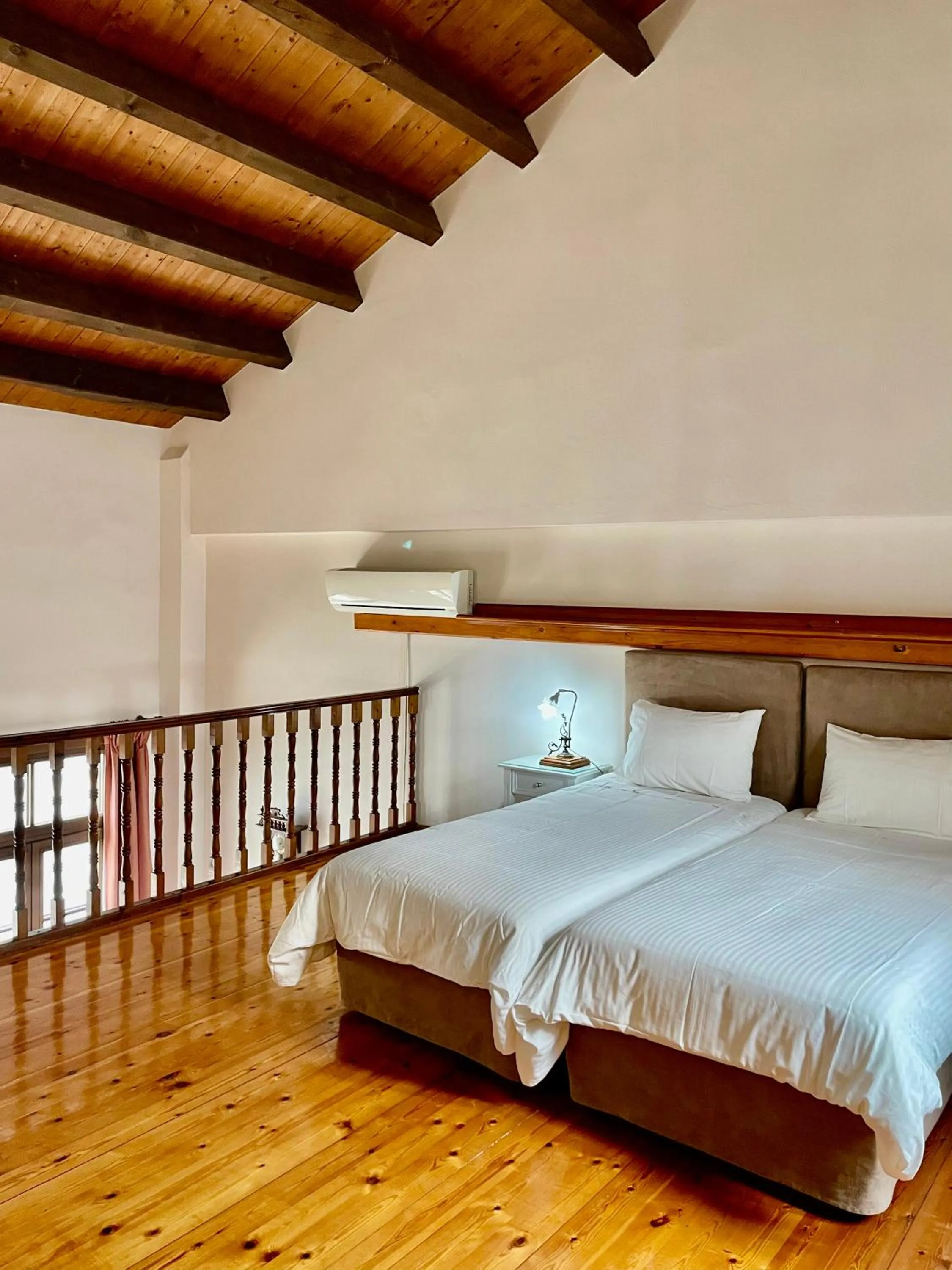 Bed in Erietta Suites