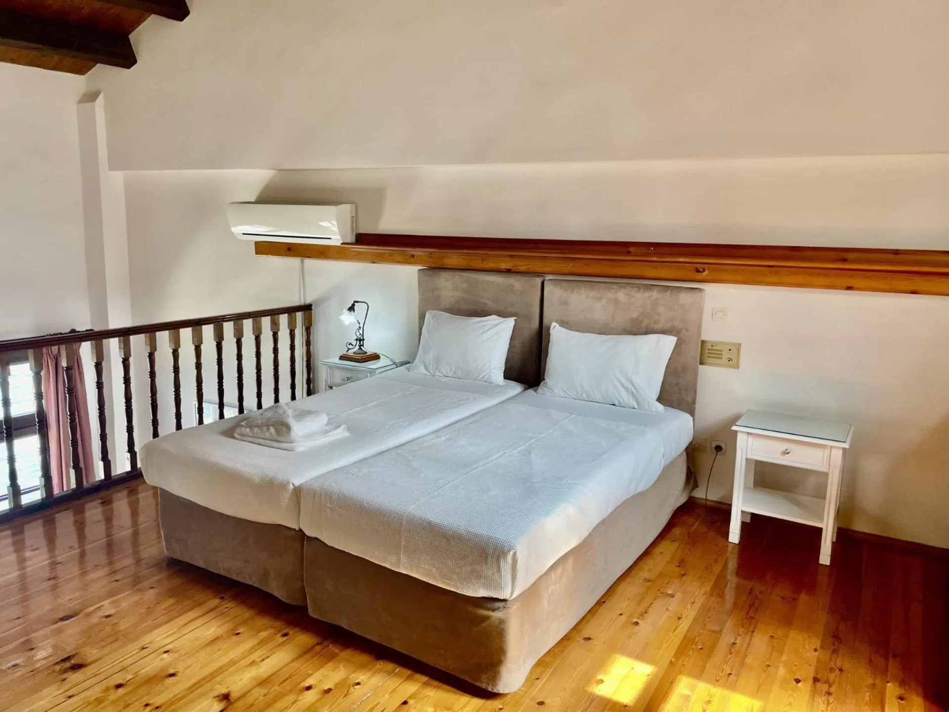 Bed in Erietta Suites