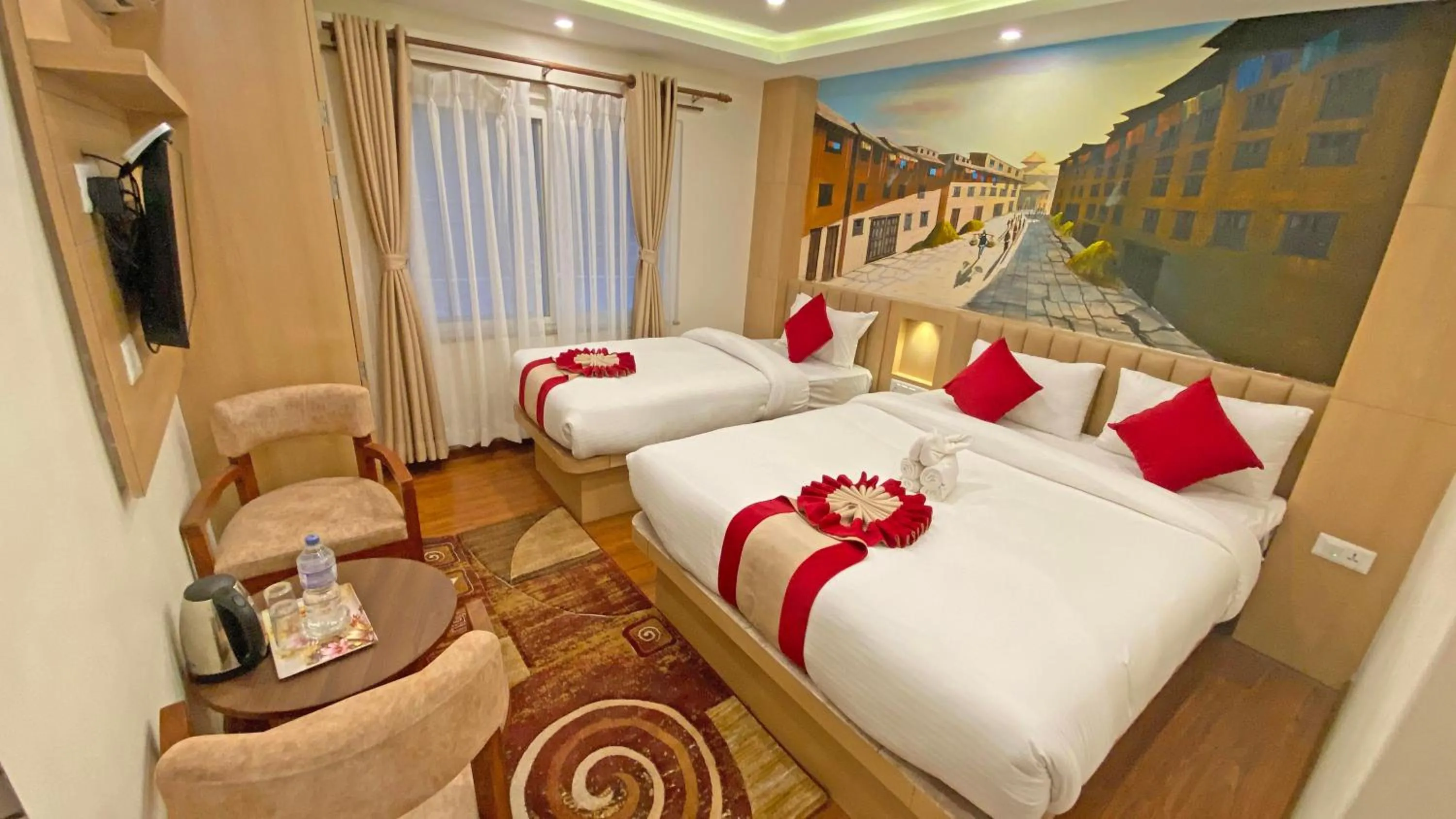 Communal lounge/ TV room, Bed in Hotel Malati