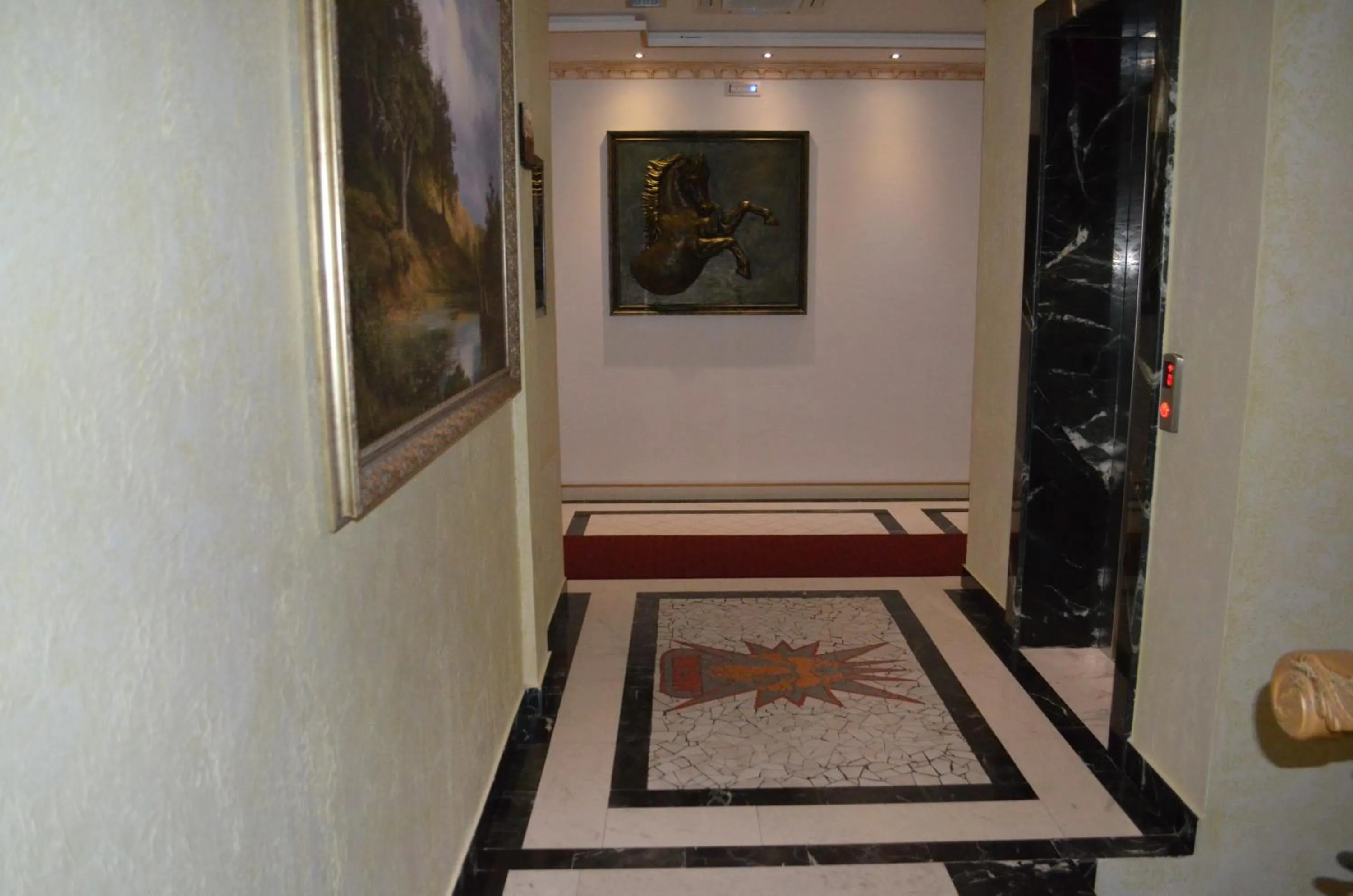 Property logo or sign in Hotel Mustang