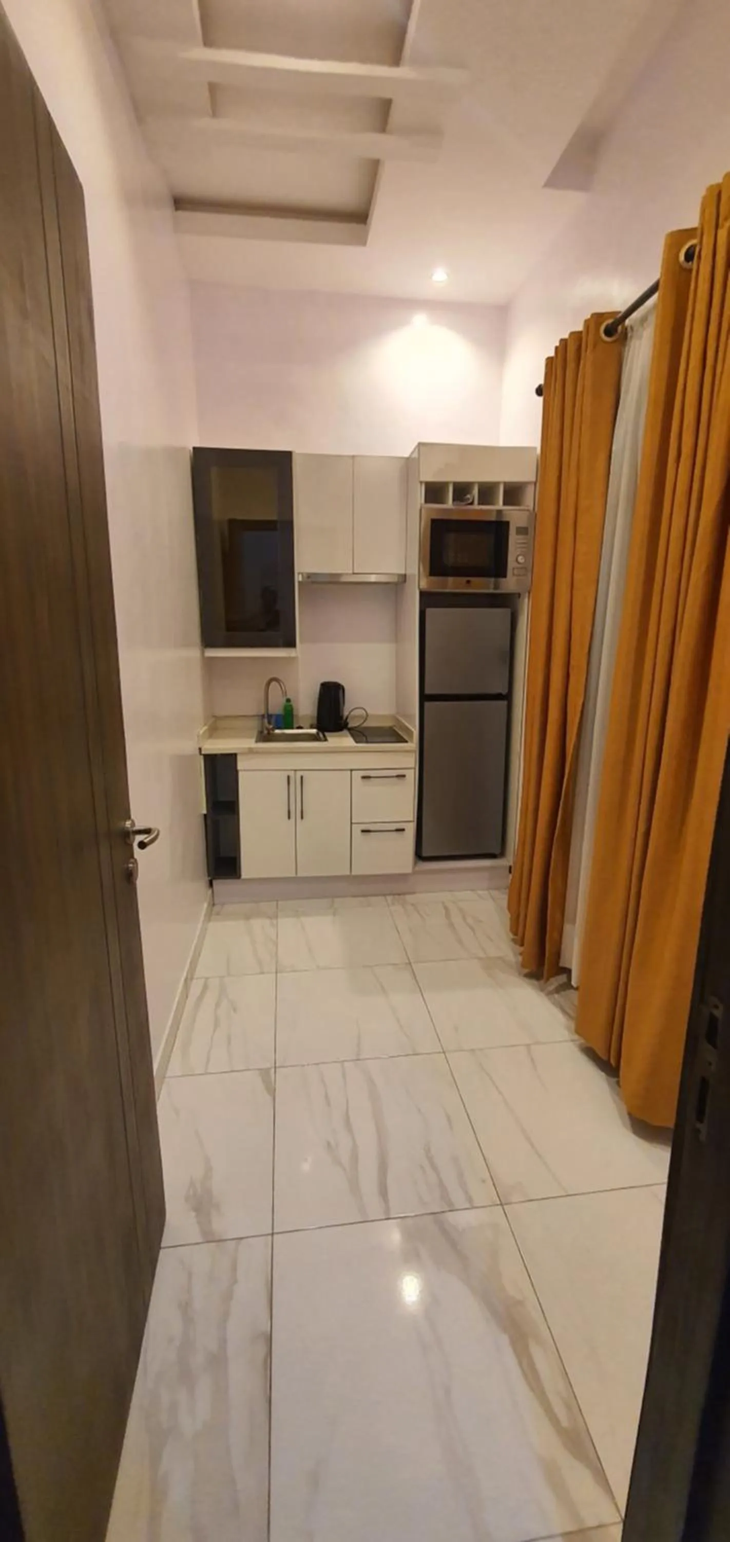 Kitchen or kitchenette, Bed in Sapphire Residences by Crystal