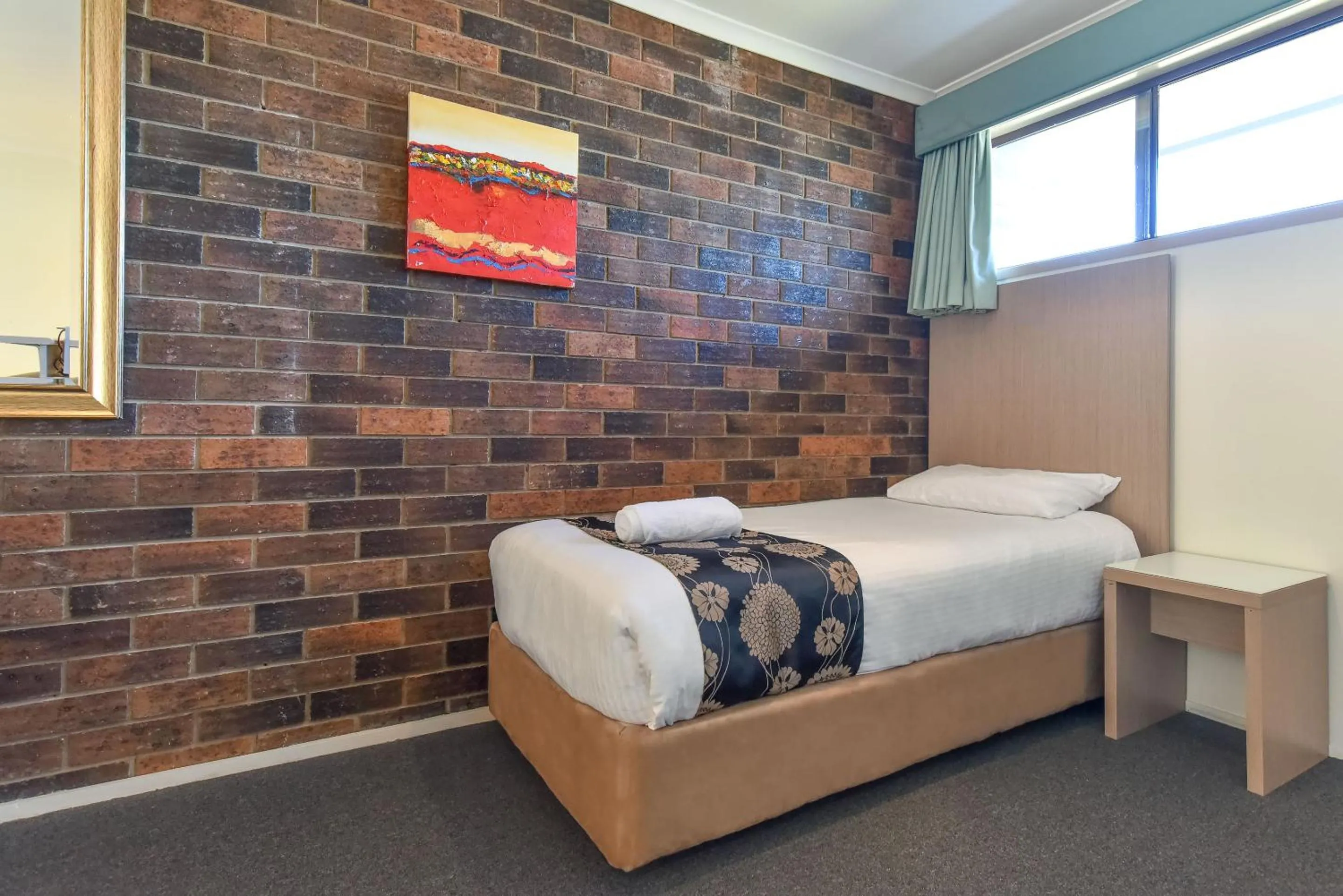 Bed in Coffs Windmill Motel