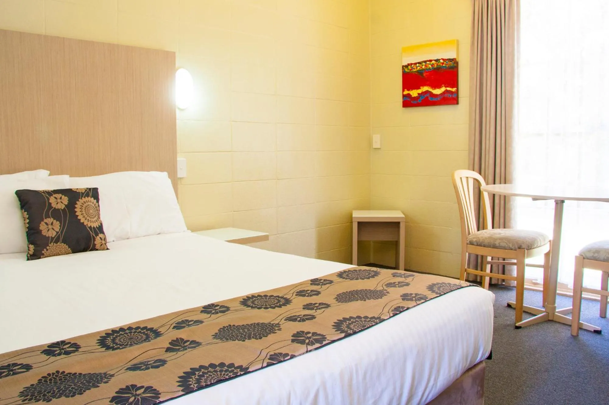 Bed in Coffs Windmill Motel