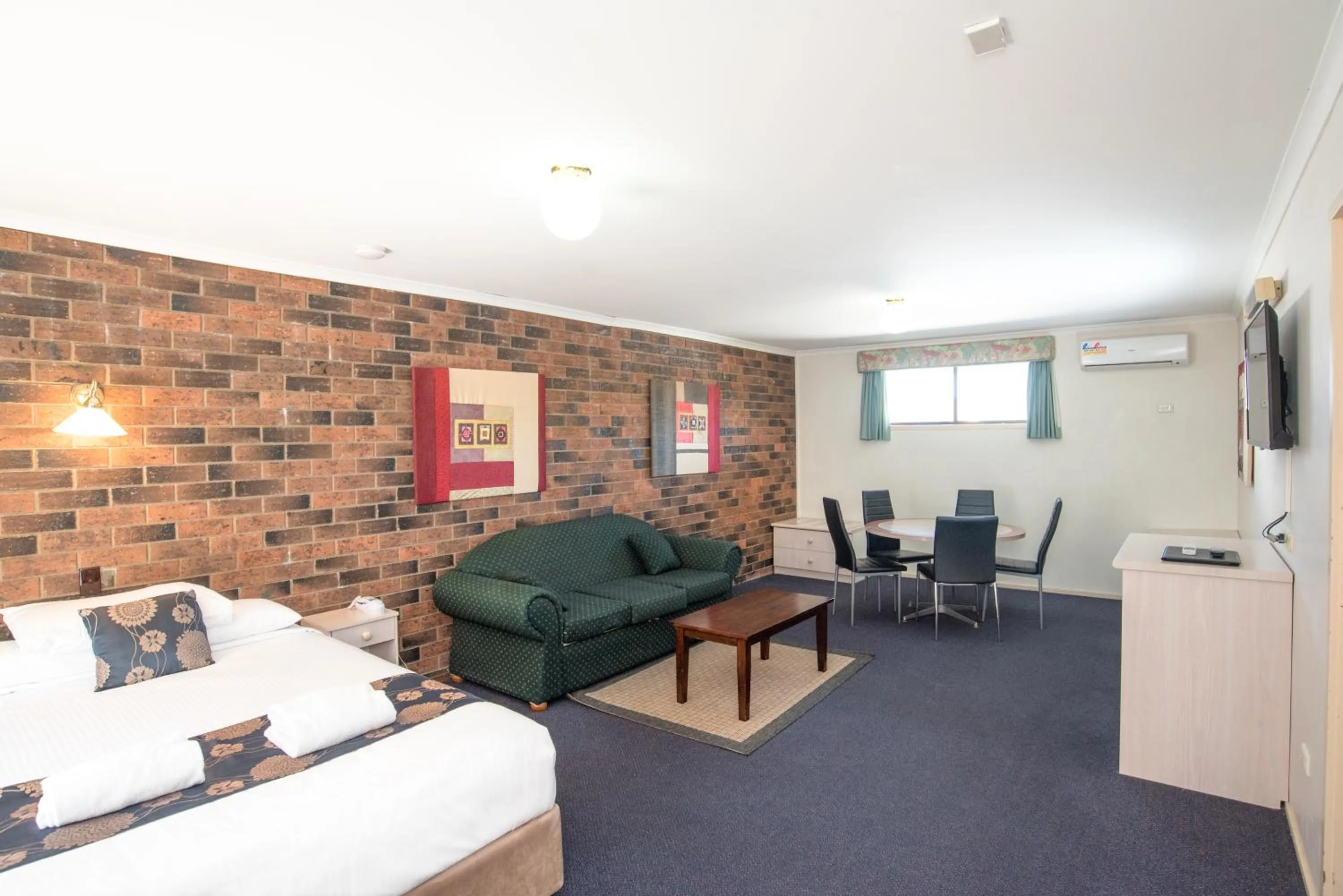 Bed in Coffs Windmill Motel