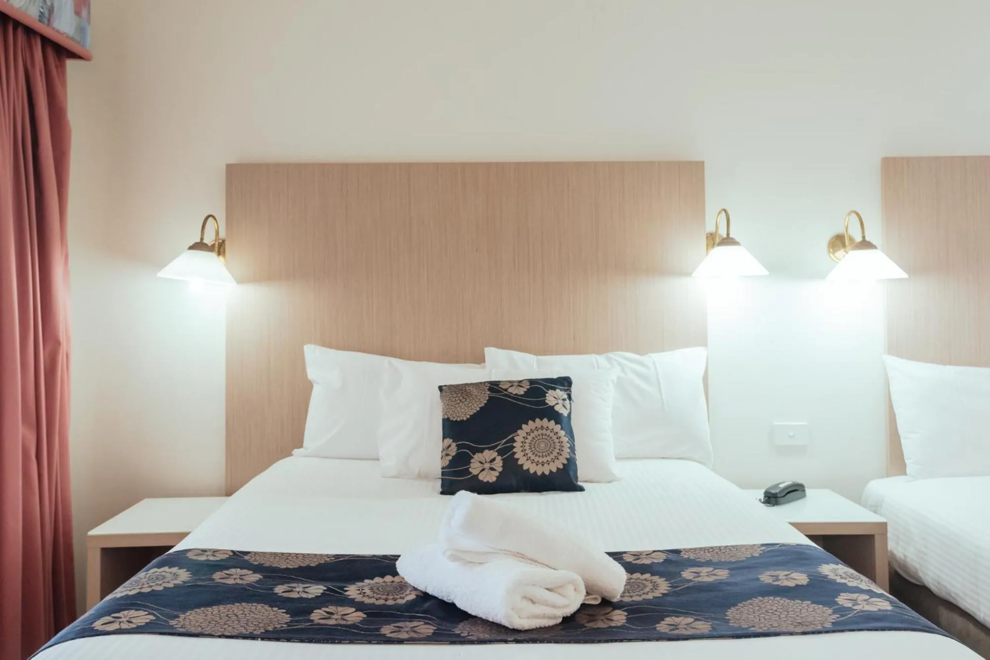 Bed in Coffs Windmill Motel