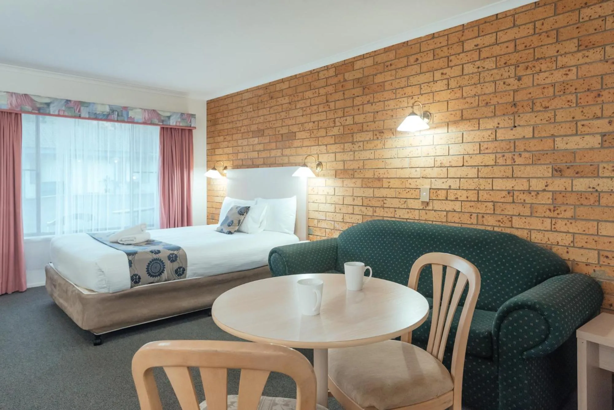 Bed in Coffs Windmill Motel