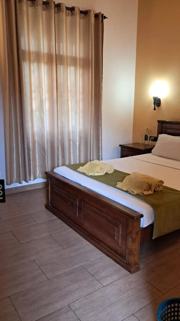 Bed in Jasmin Villa Ayurveda Resort
