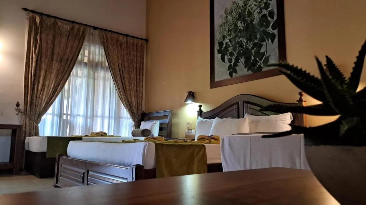 Bed in Jasmin Villa Ayurveda Resort