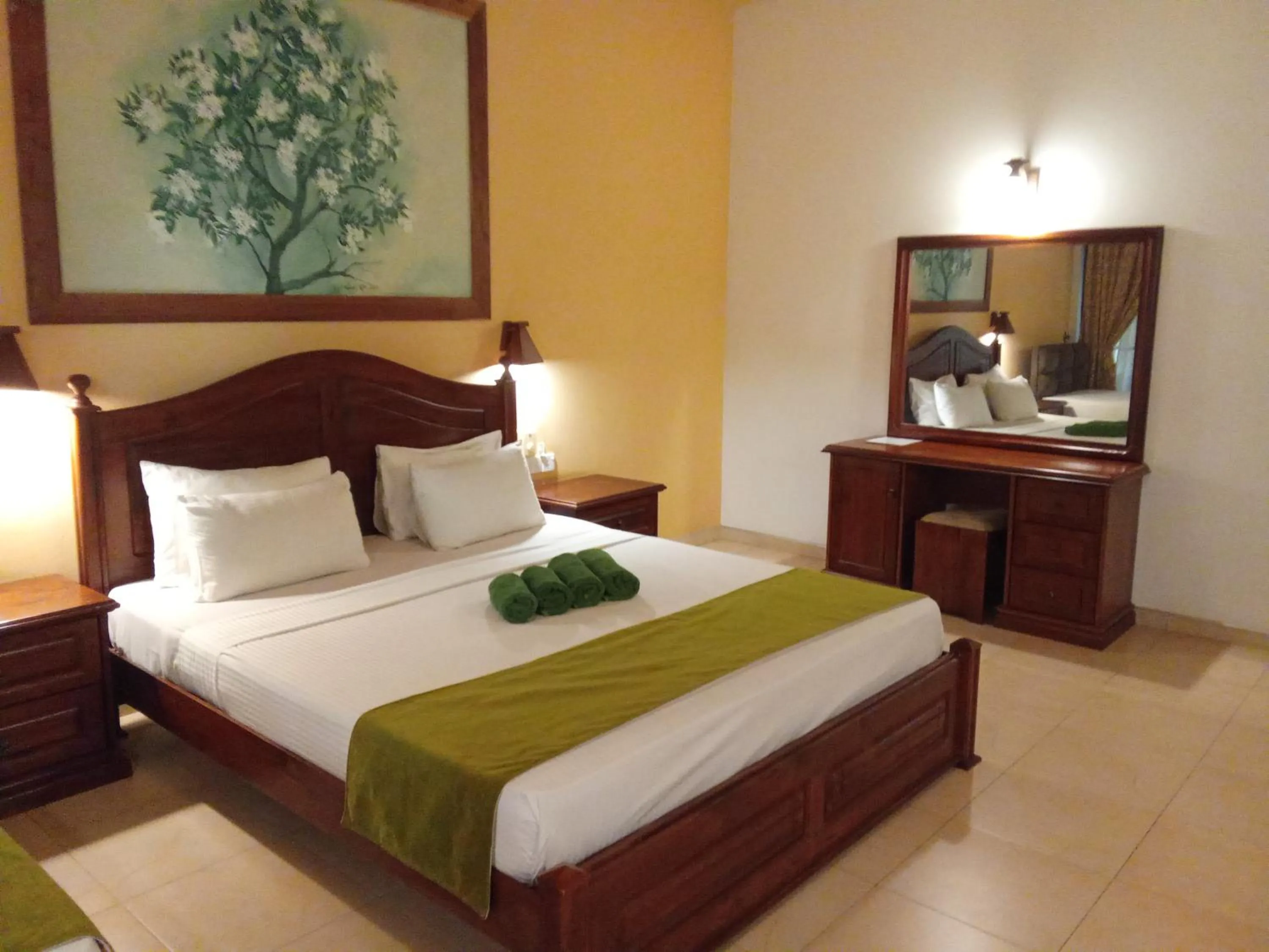 Bed in Jasmin Villa Ayurveda Resort