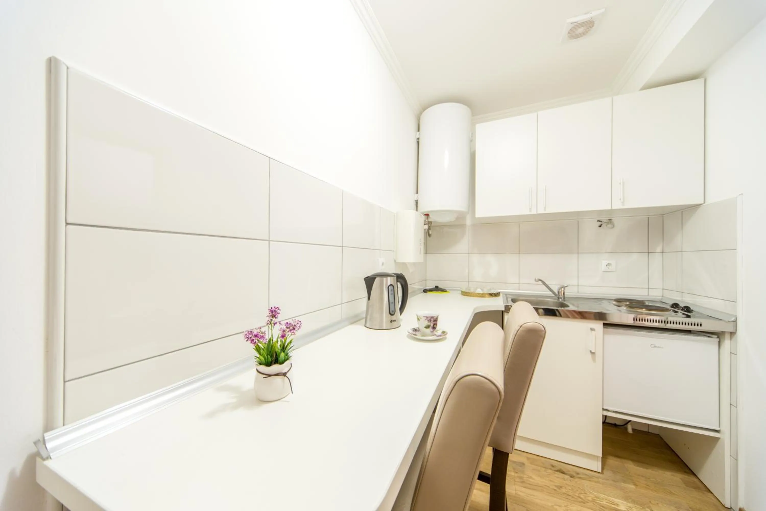Kitchen or kitchenette in F Apartmani Kragujevac