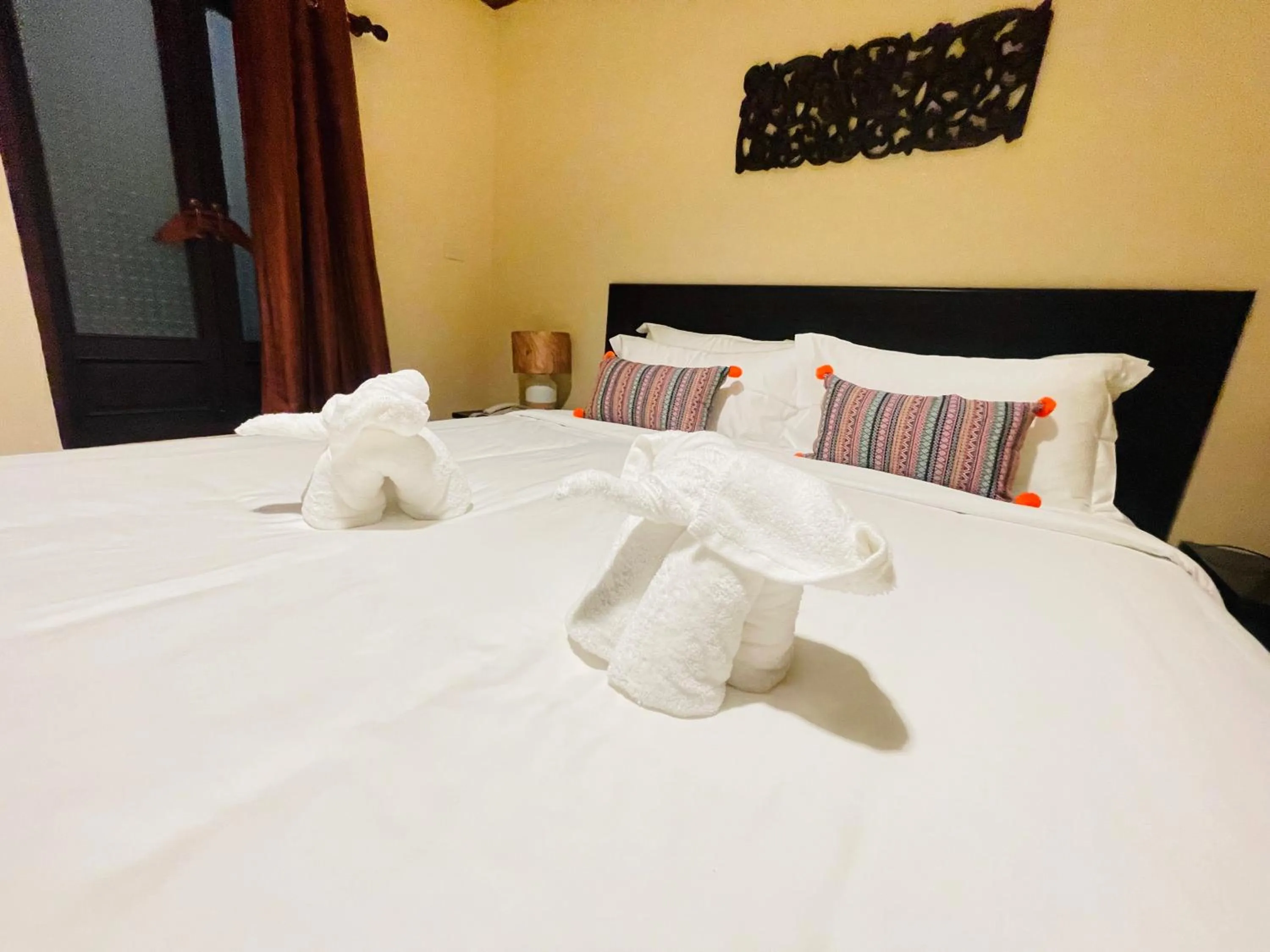 Bed in Na Thapae Chiangmai Hotel