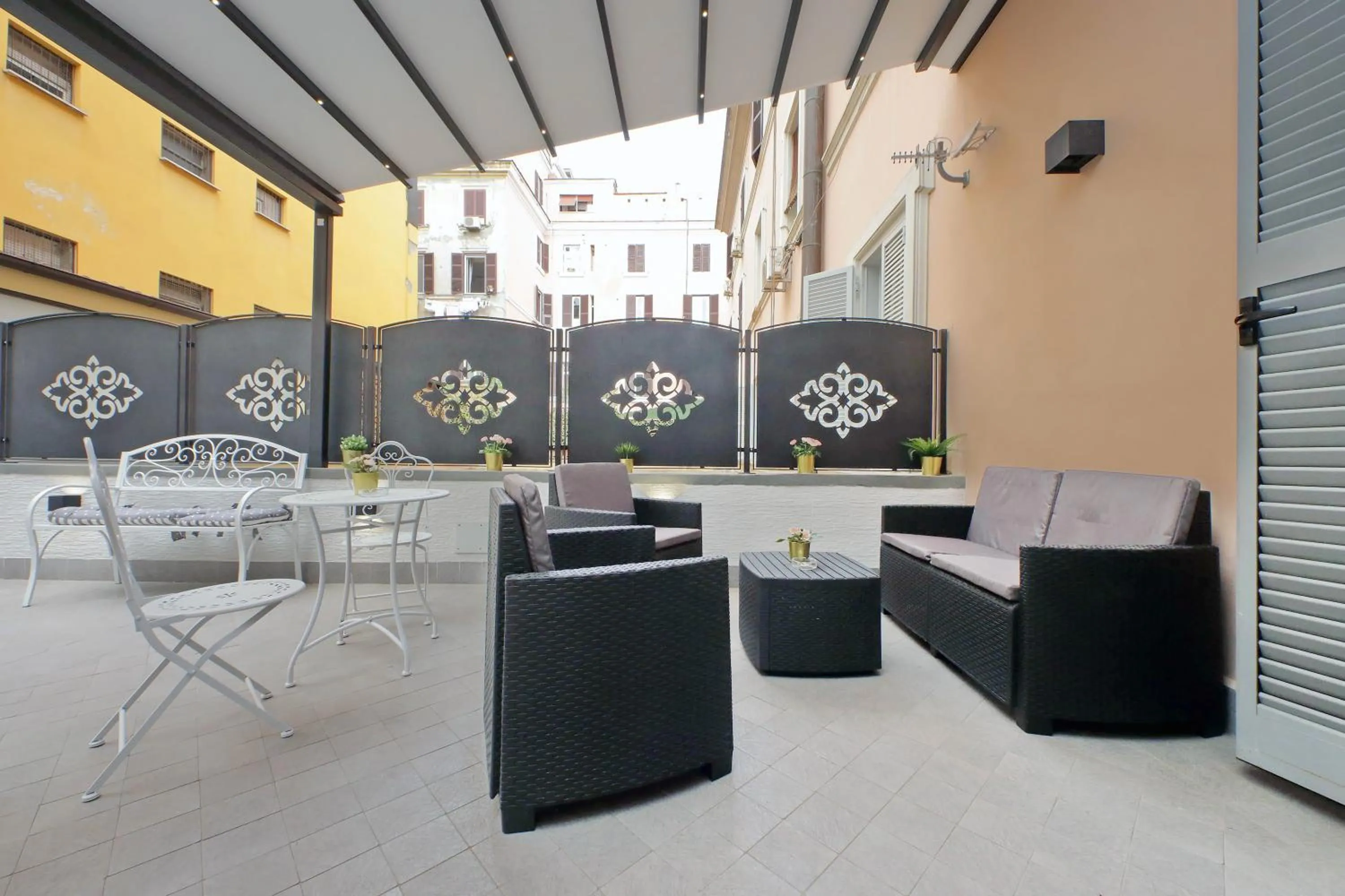 Patio in Roman Holiday Suites