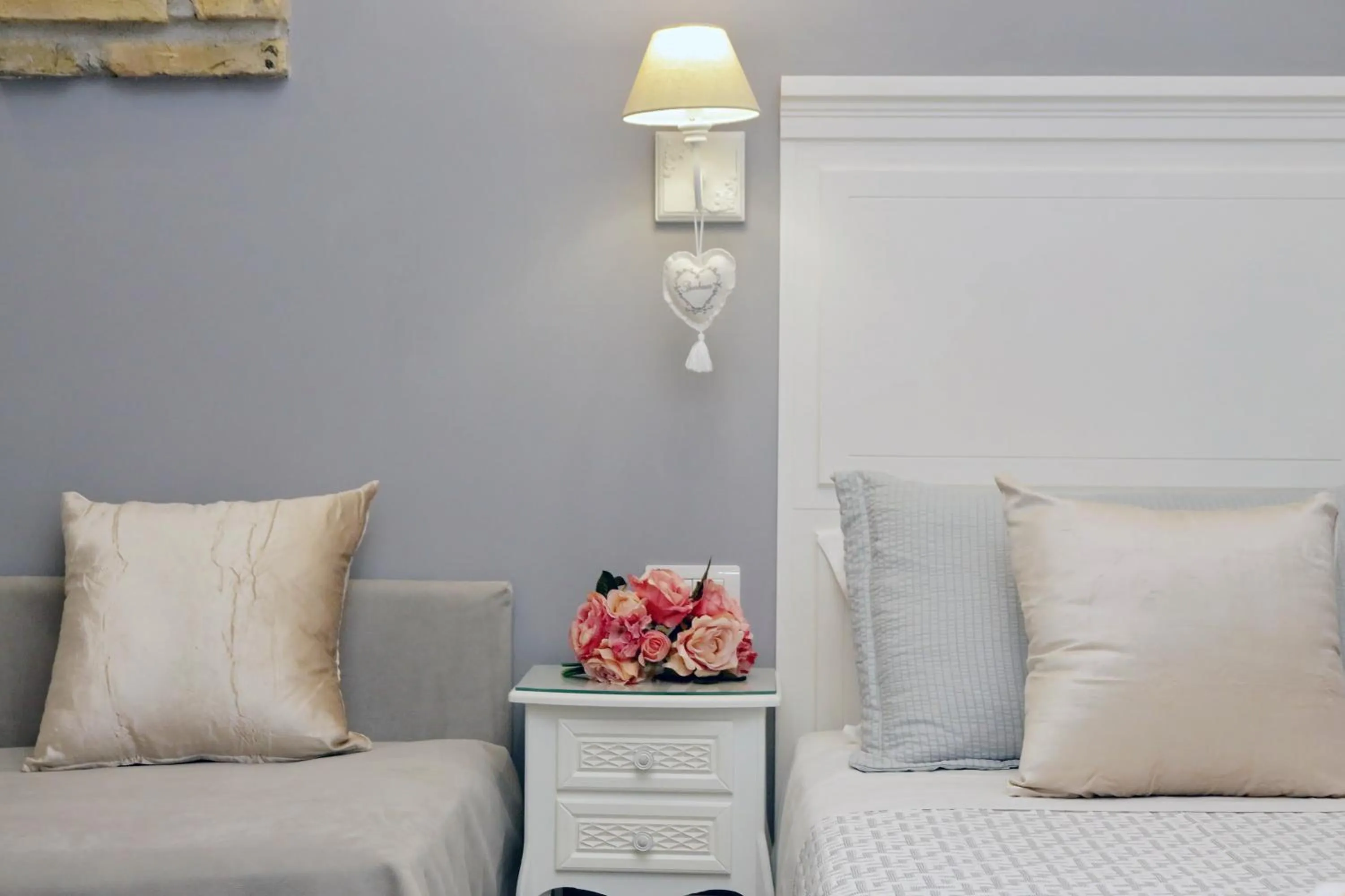 Bed in Roman Holiday Suites